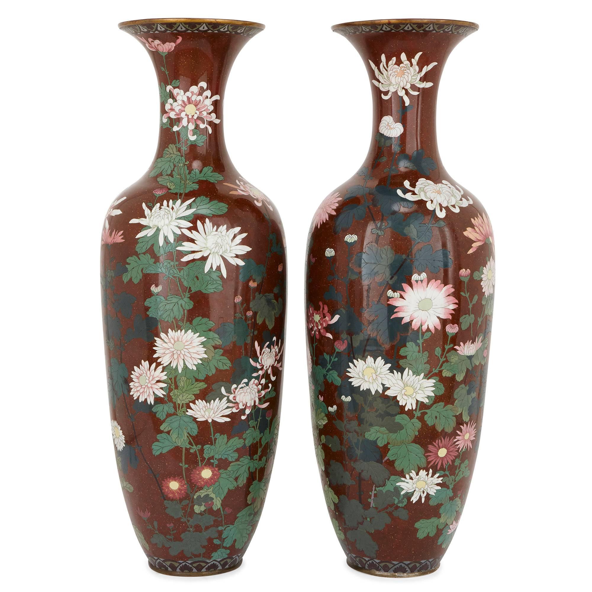 These beautiful Japanese vases were crafted during the Meiji period of the late 19th Century, which was referred to as the Golden Age of cloisonne enameling. 

The vases are of elongated ovoid shape, with waisted necks and flared rims. The vases
