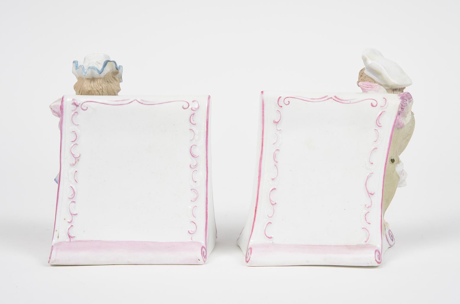 Porcelain Pair of Antique Meissen Style Female & Male Cherub Menu Stands For Sale