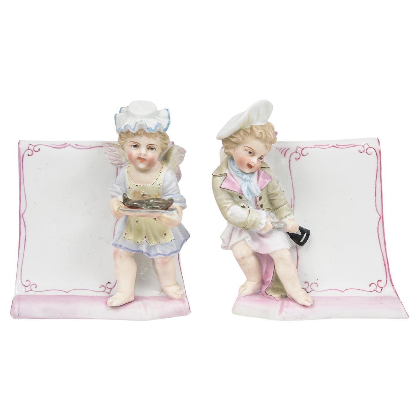 Pair of Antique Meissen Style Female & Male Cherub Menu Stands For Sale