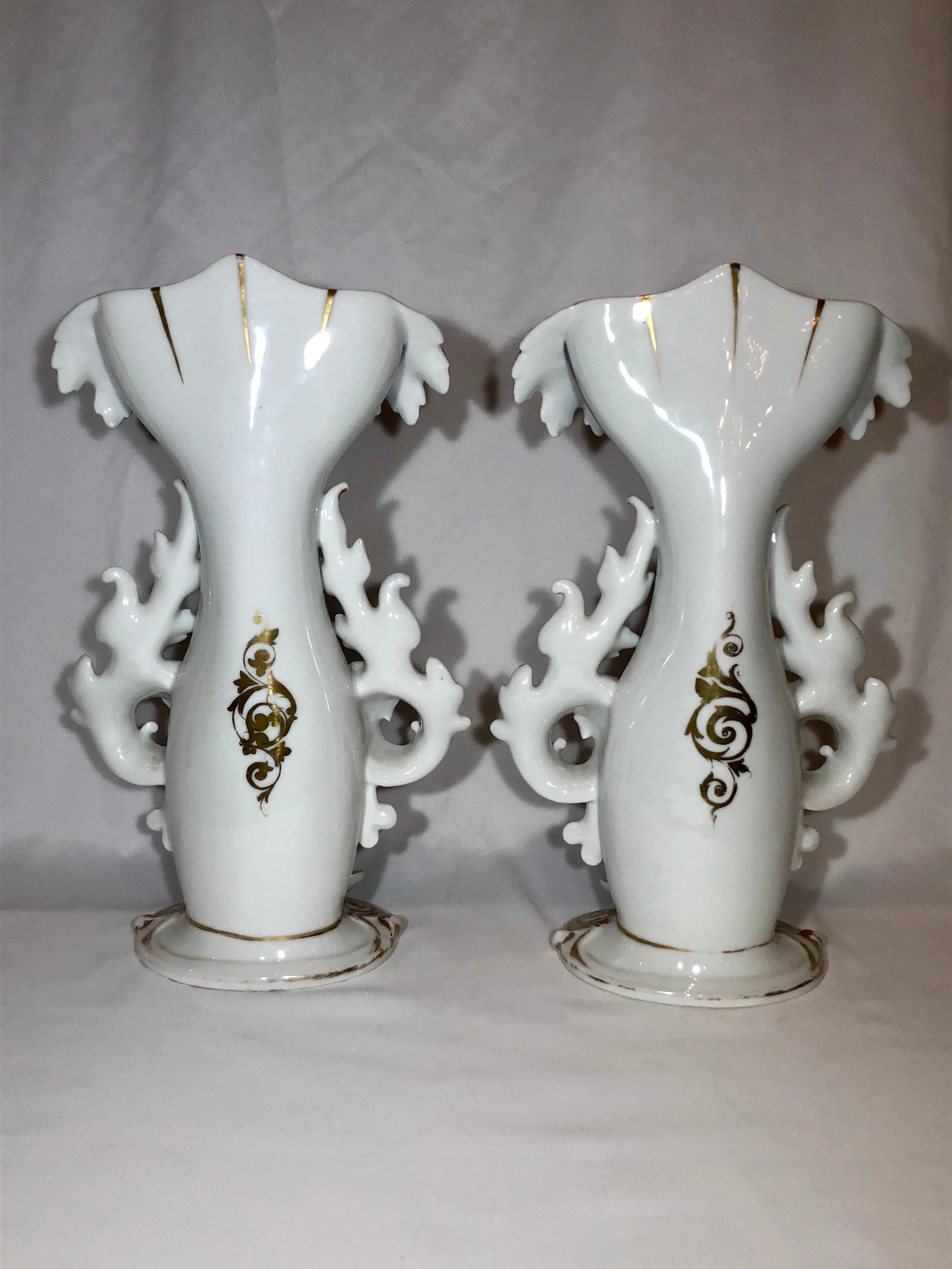Pair of antique mid-19th century Old Paris vases. From a Louisiana estate. These are beautiful and boast unusual, strong colors.