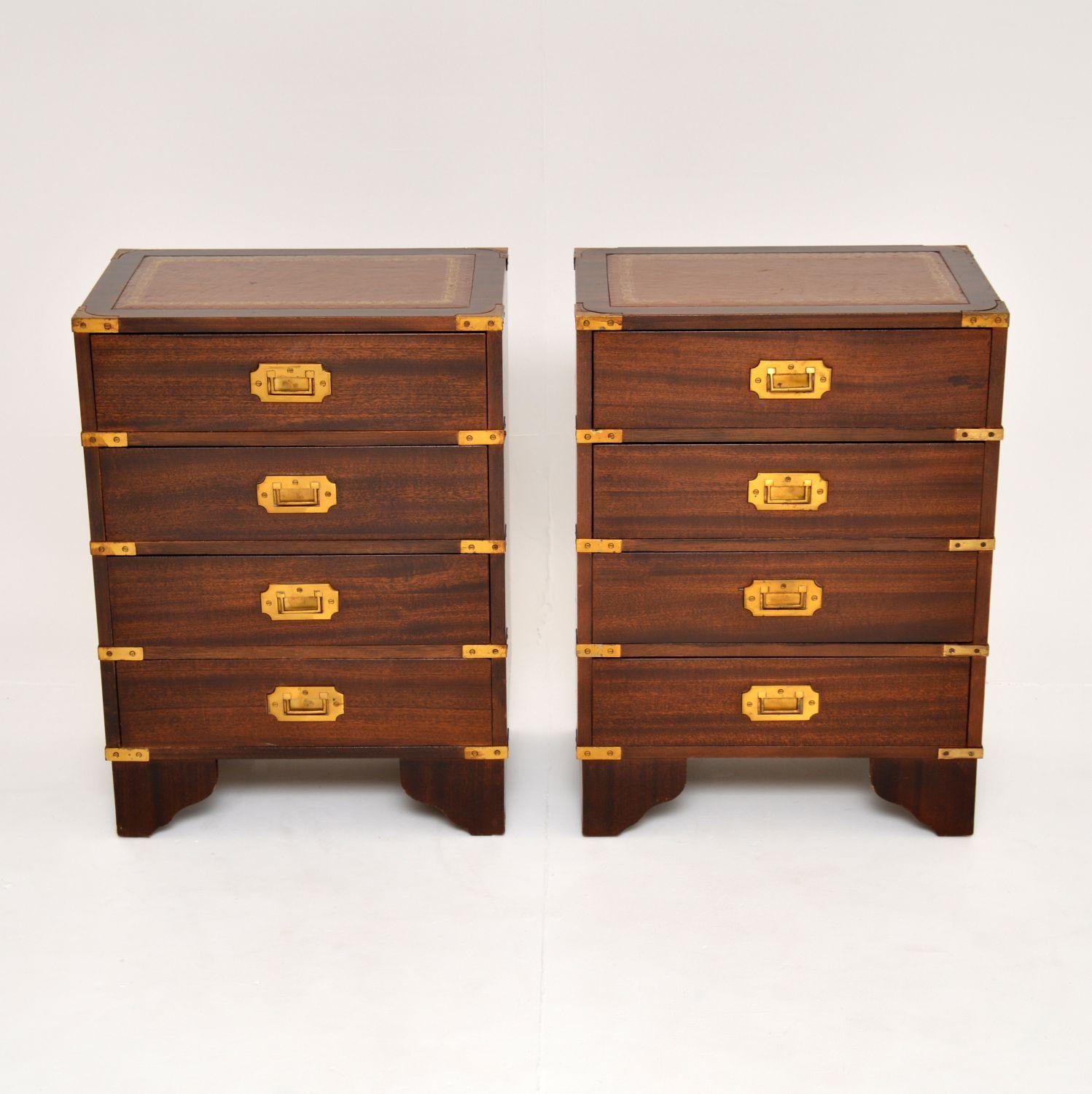 A lovely pair of bedside chests in the antique military style. These were made in England, they date from around the 1950’s.

They are well made and are a very useful size. There are fine quality brass fixtures and handles, each has an inset gold