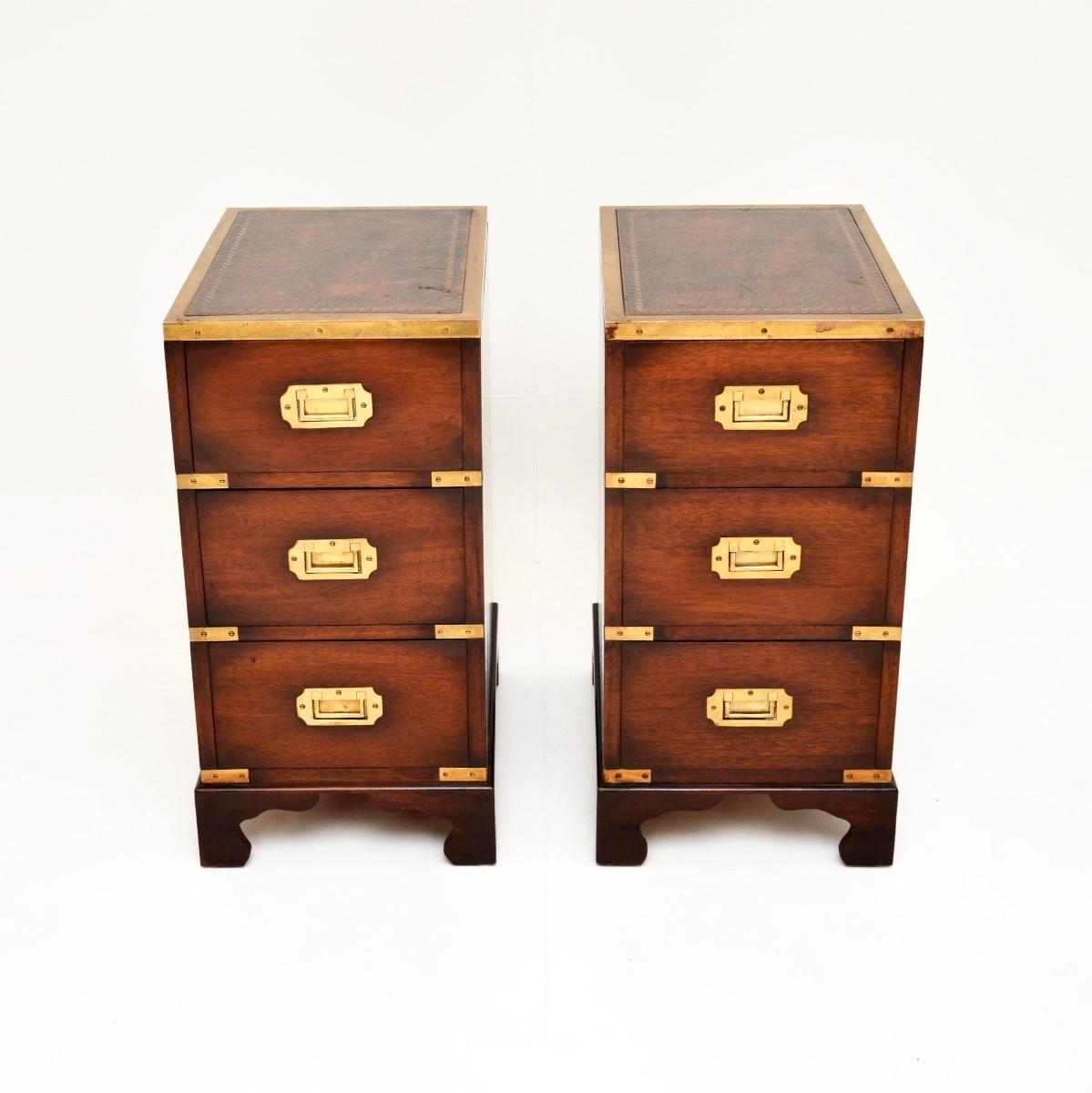 A smart and very well made pair of antique military campaign style bedside chests. They were made in England, and date from around the 1930’s.

The quality is outstanding, they are beautifully designed and are a great size. The wood has a gorgeous