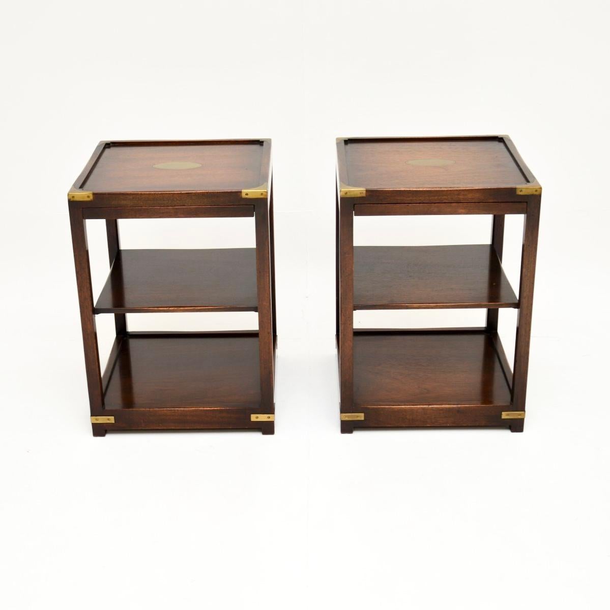 A smart and extremely well made pair of antique military campaign style side tables. They were made in England, and date from around the 1950’s.

The quality is outstanding, they have a very stylish and useful design, perfect for use as lamp tables