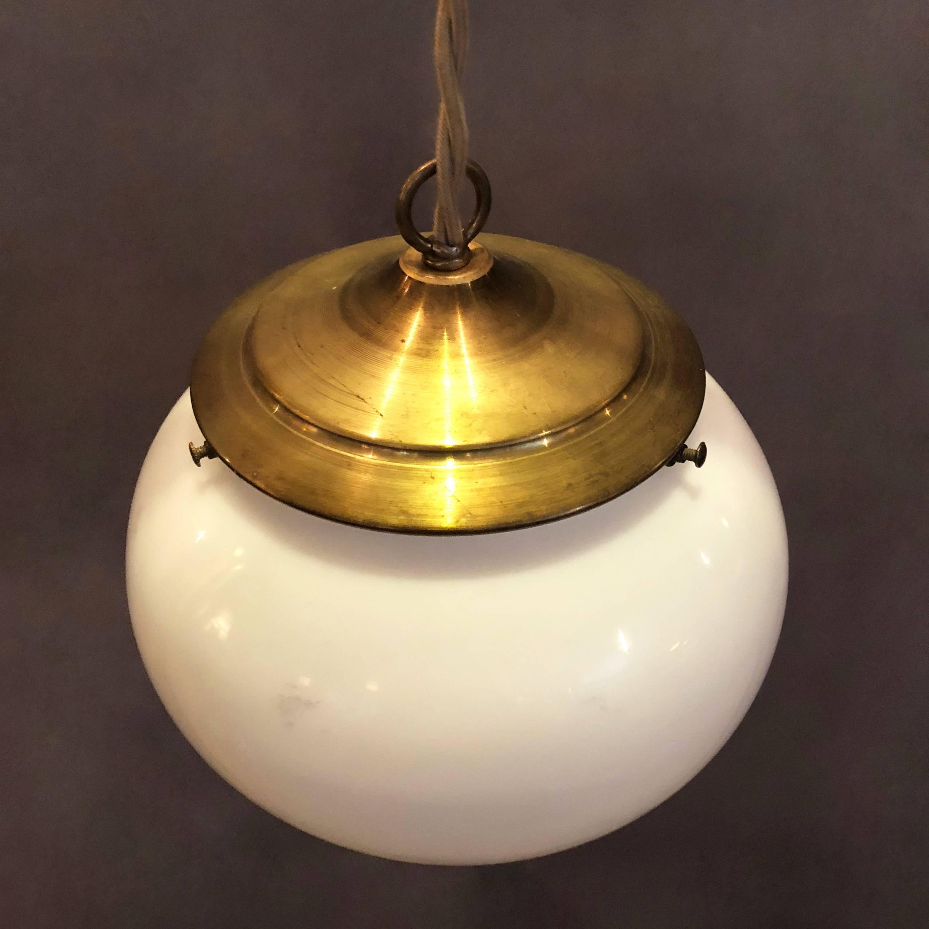 Pair of Antique Milk Glass Open Orb Brass Pendant Lights In Excellent Condition In Brooklyn, NY