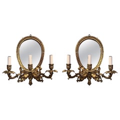 Paire d'appliques murales anciennes en miroir