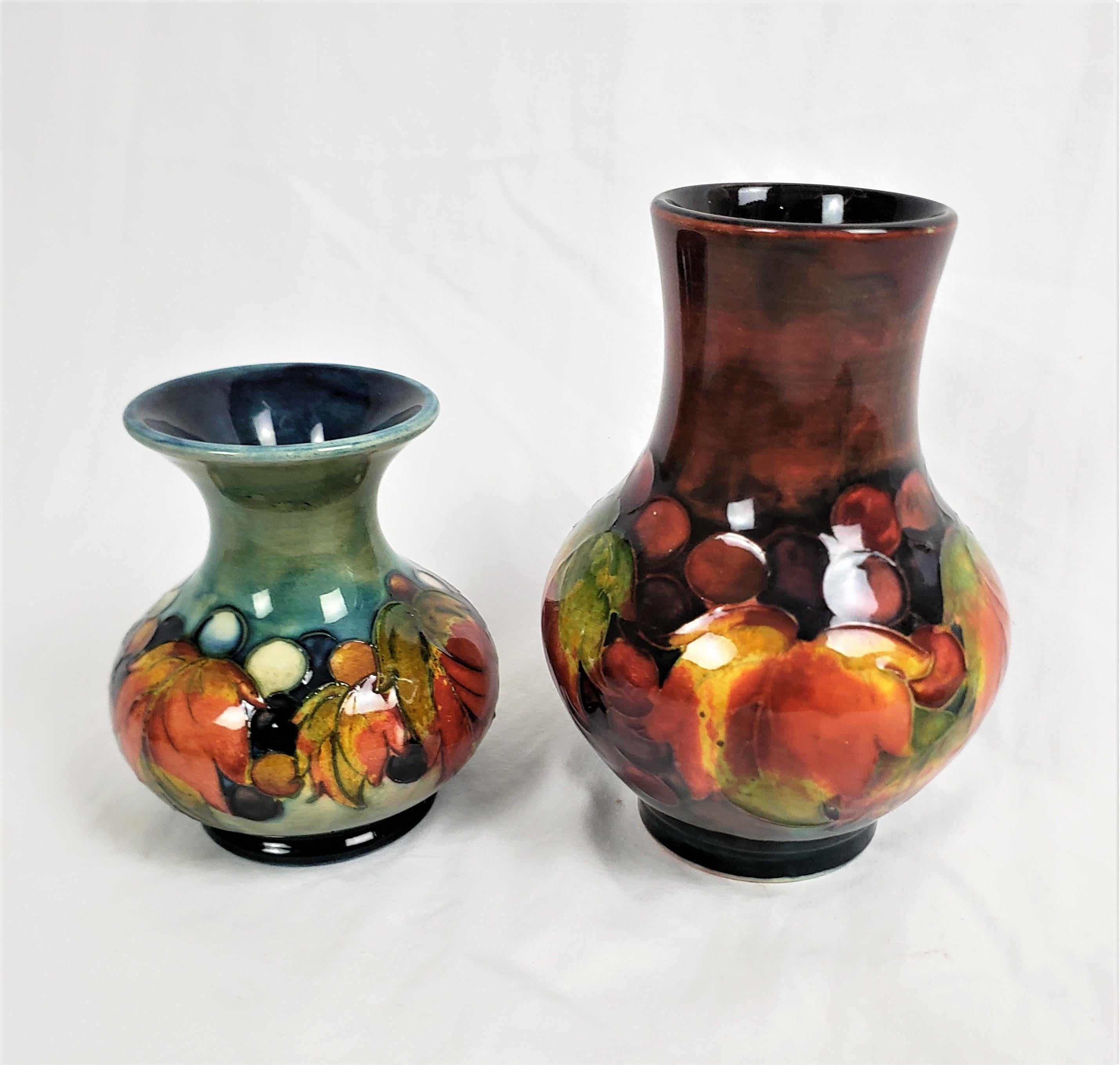 English Pair of Antique Moorcorft Art Pottery Vases with Flambe in Leaf & Berry Pattern For Sale