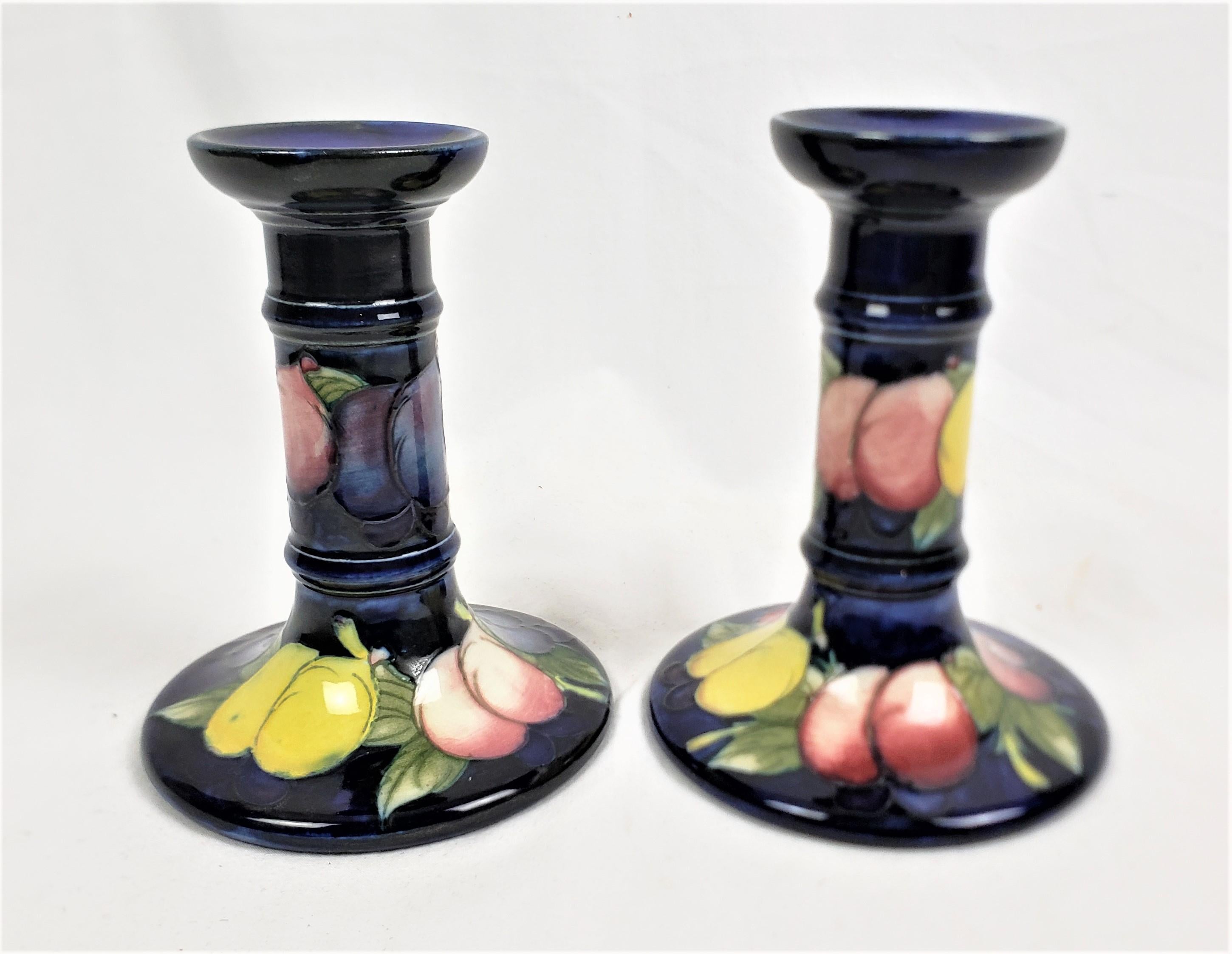 Hand-Crafted Pair of Antique Moorcroft Art Pottery Candlesticks in the Wisteria Pattern For Sale