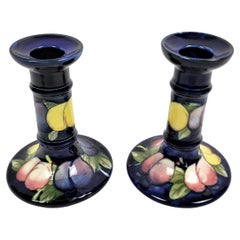 Pair of Antique Moorcroft Art Pottery Candlesticks in the Wisteria Pattern