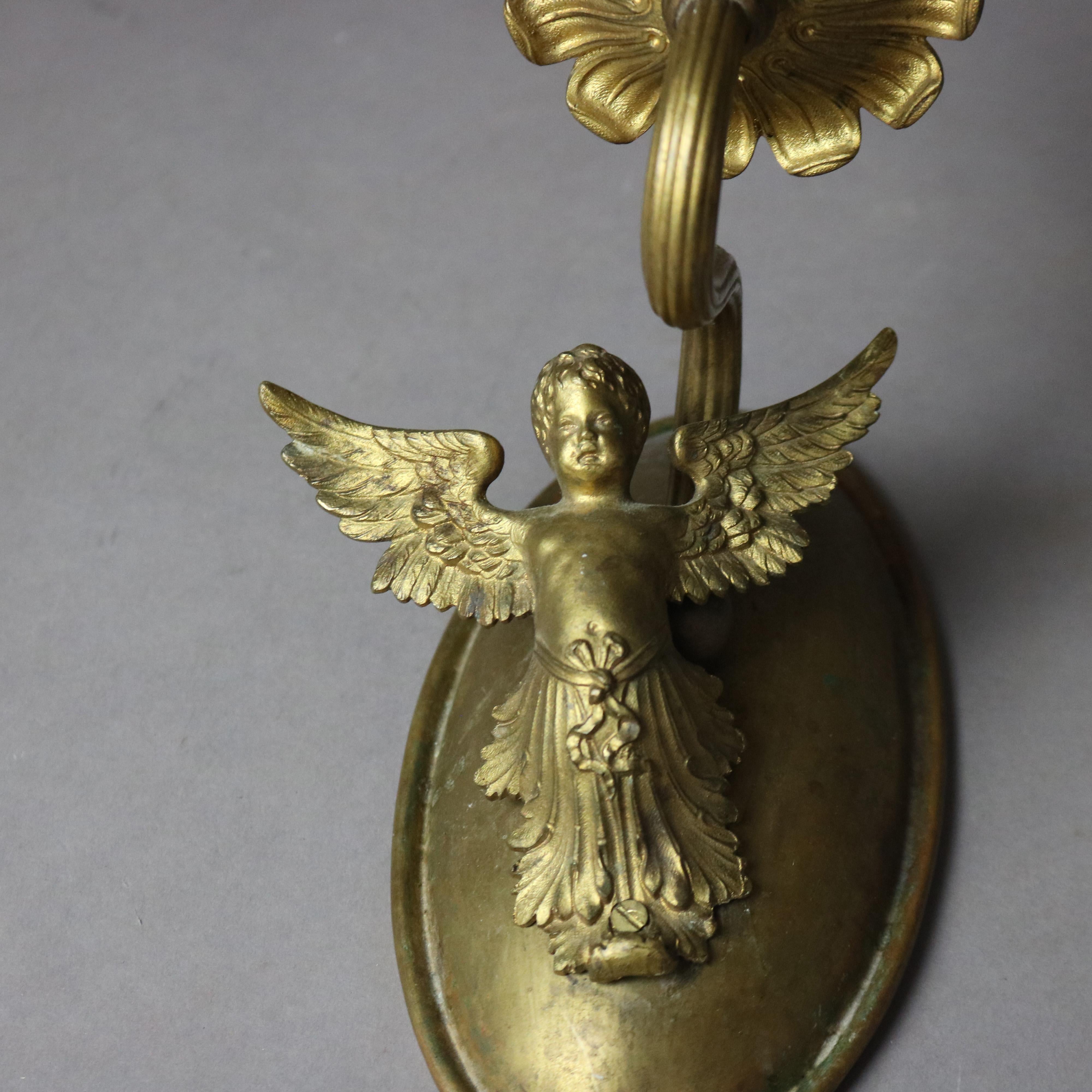 Pair of Antique Neoclassical Figural Cherub Brass Single Light Wall Sconces

Measures - 8 5/8