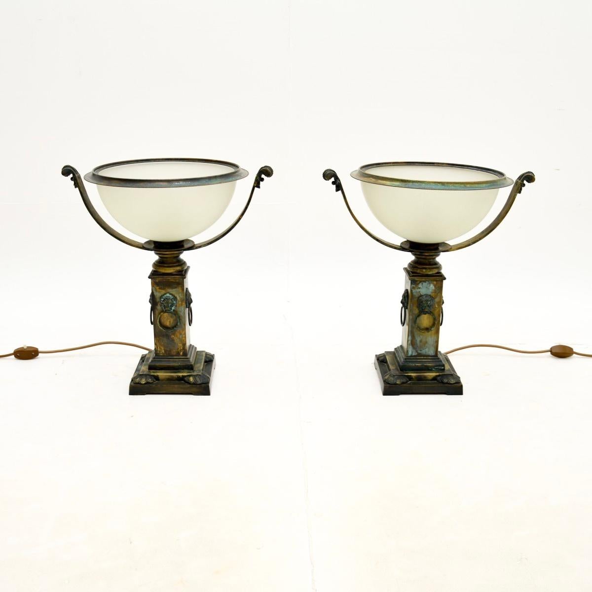A wonderful pair of antique neoclassical style brass and glass table lamps. They were made in England, they date from the mid twentieth century, likely the 1970’s.

They are of outstanding the quality, the brass has an absolutely gorgeous patina and