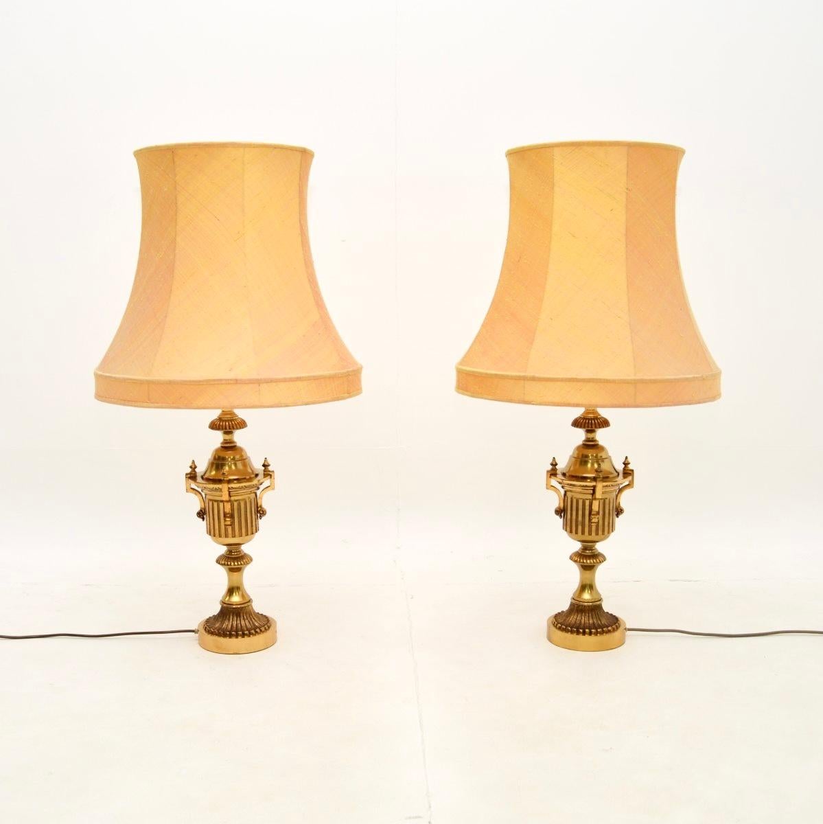 A stunning pair of antique neoclassical style brass table lamps. They were made in England, they date from around the 1930’s.

The quality is outstanding, the solid brass lamp bases have beautiful and intricate details. They are a large and