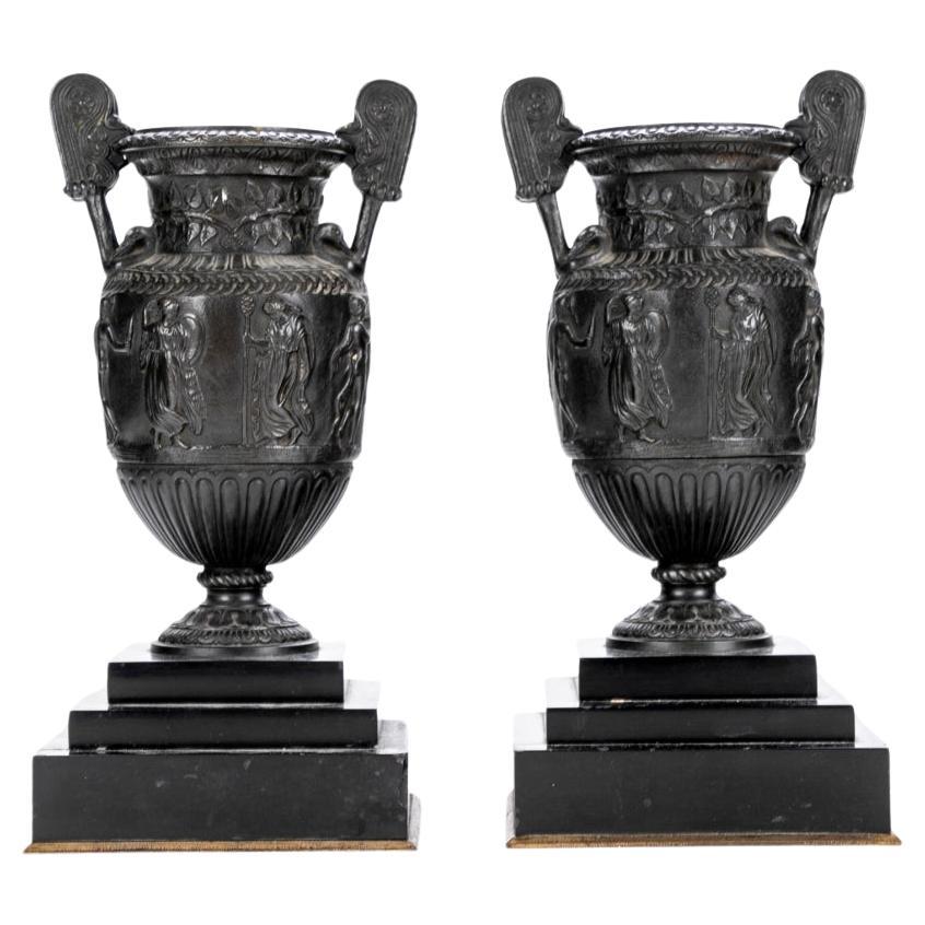 Pair Of Antique Neoclassical Style Bronze Urns Mounted On Slate  Plinth Bases For Sale