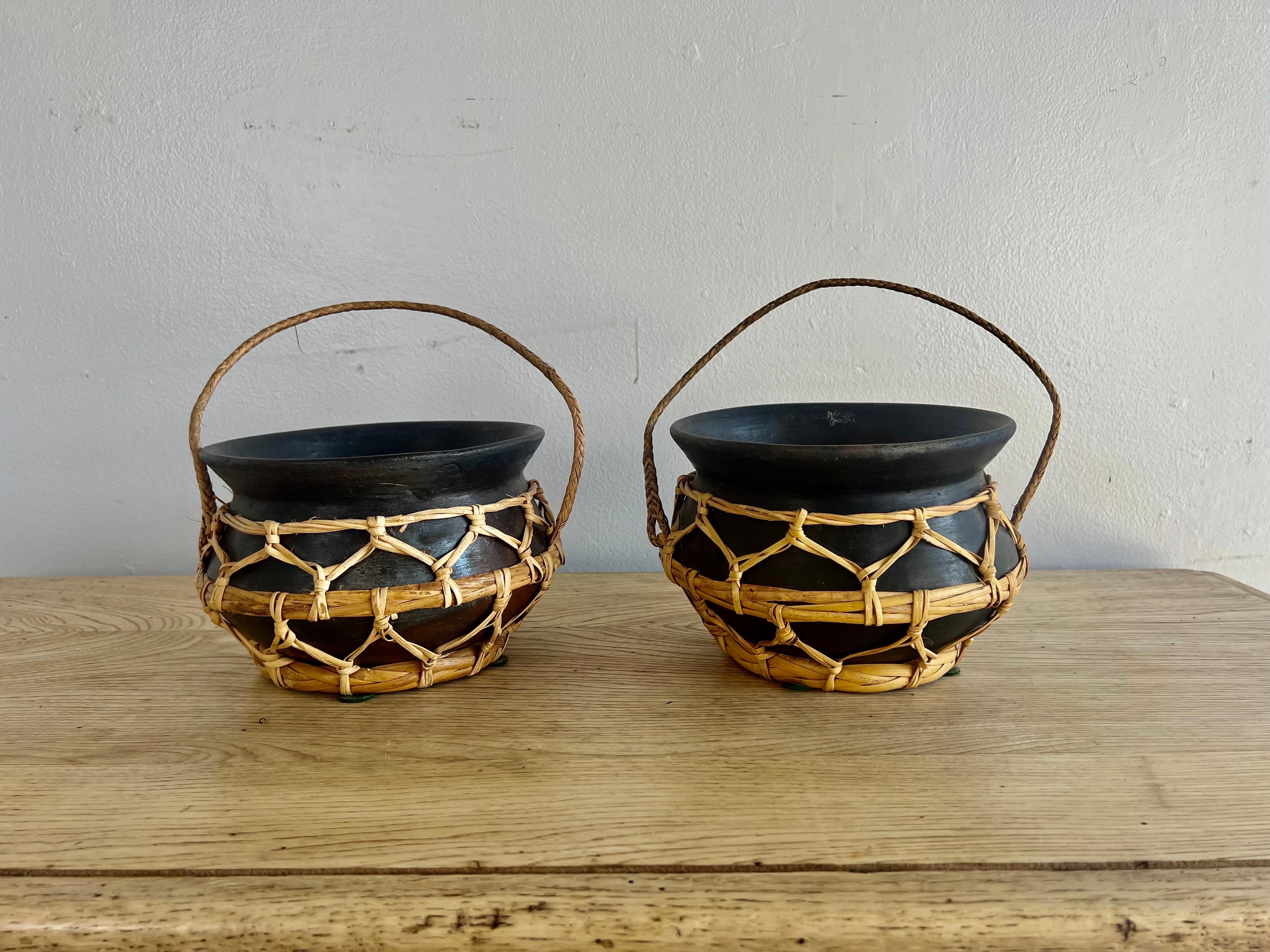 Pottery Pair of Antique Nigerian Nupe Clay Pots w/ Rattan Handles For Sale