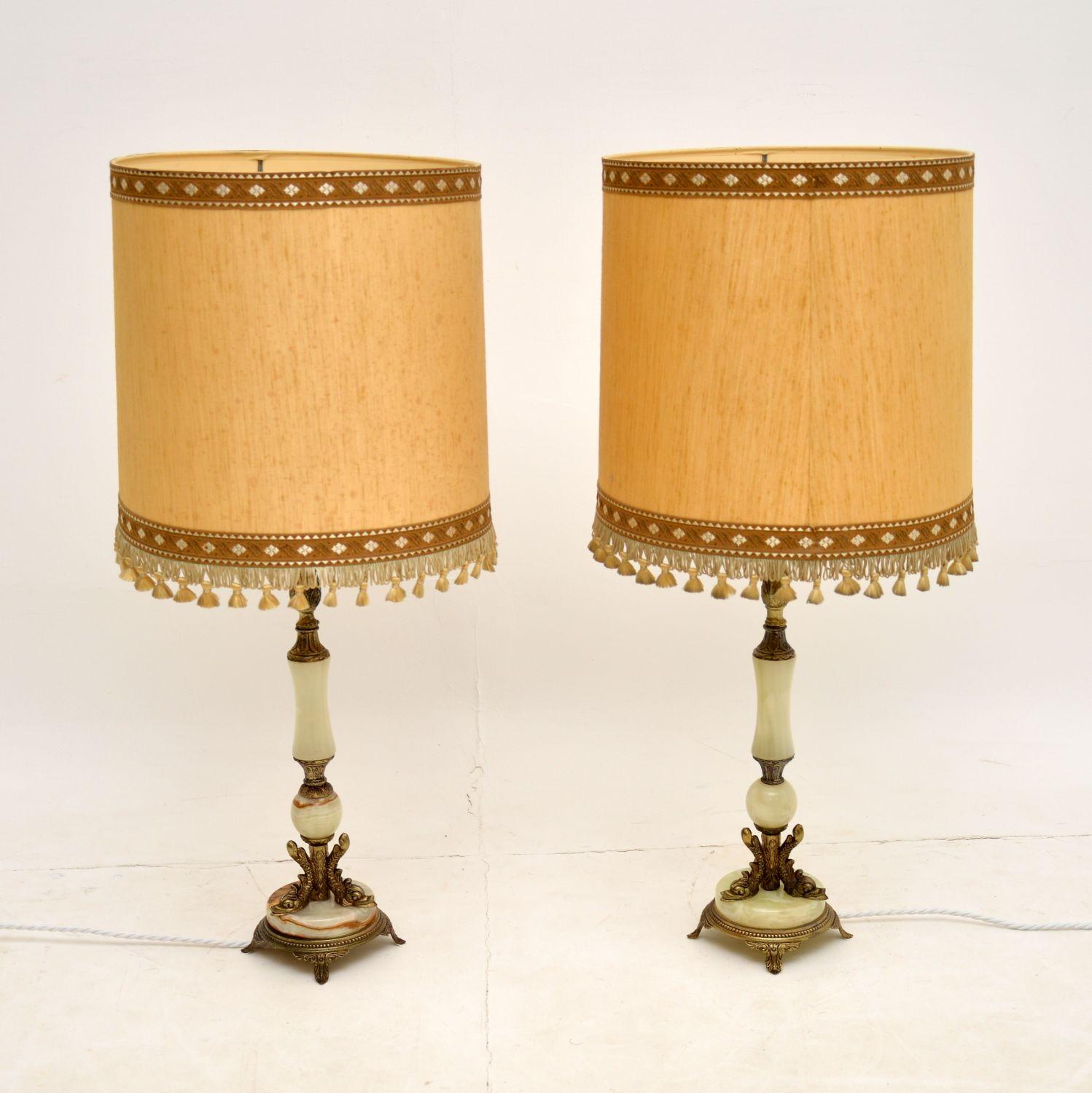A stunning matched pair of vintage brass and onyx table lamps. These were most likely made in France, they date from the 1930-50’s.

The design is beautiful and these are of lovely quality. The brass work is fine and intricate, with interesting