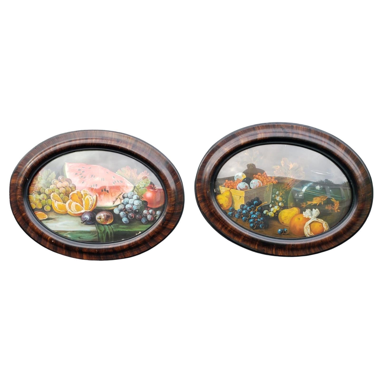This is a nice, antique, oval tiger wood veneer frame with convex / bubble glass. Inside, is an print with various fruits.

This is a nice, solid frame, showing some typical cosmetic wear consistent with it's age. There are some relatively minor