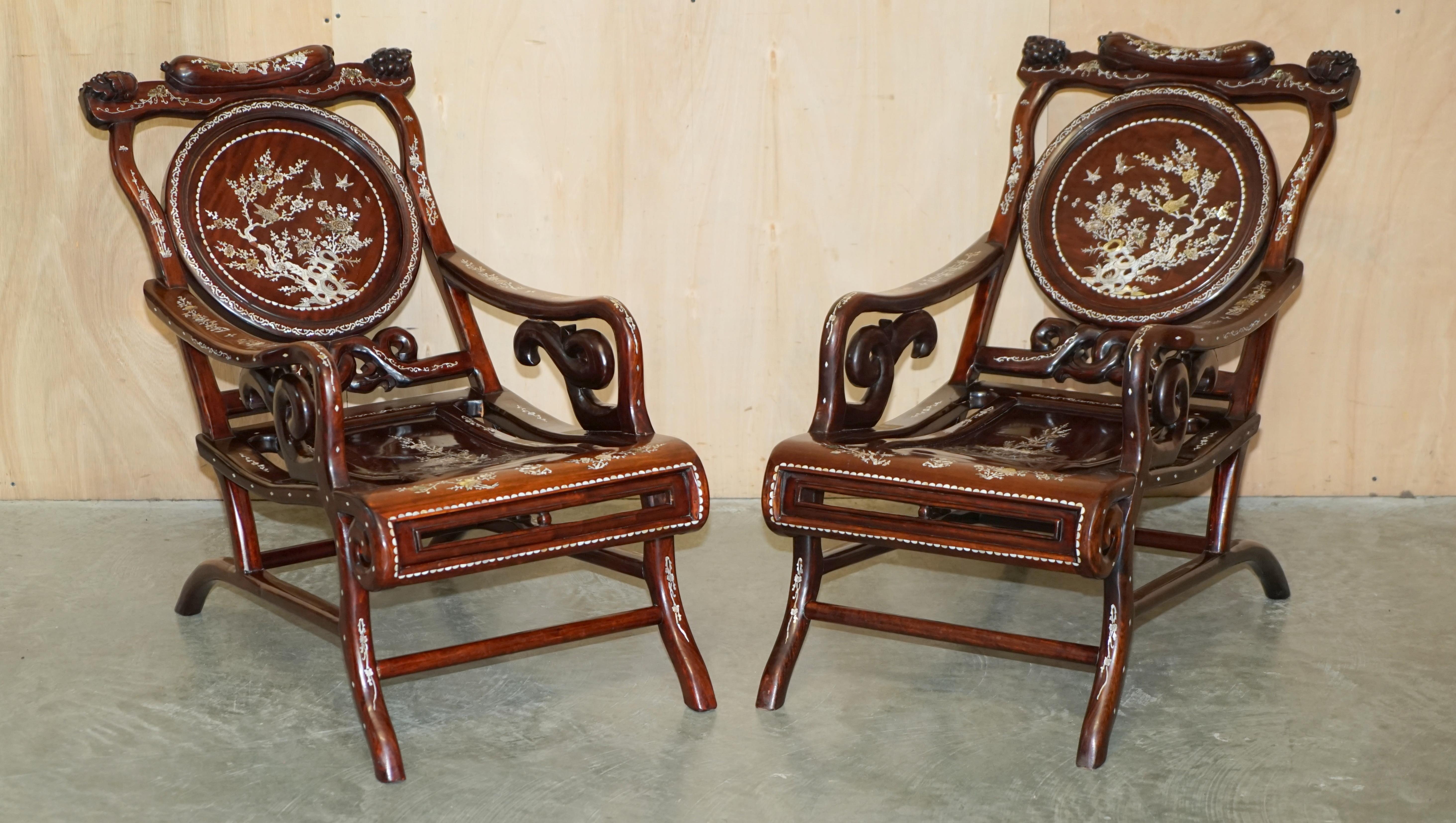 We are delighted to offer for sale this stunning pair of antique Chinese Padauk wood with ornate Mother of Pearl inlay reclined plantation style armchairs with matching side table

A very good looking and decorative pair of antique Chinese