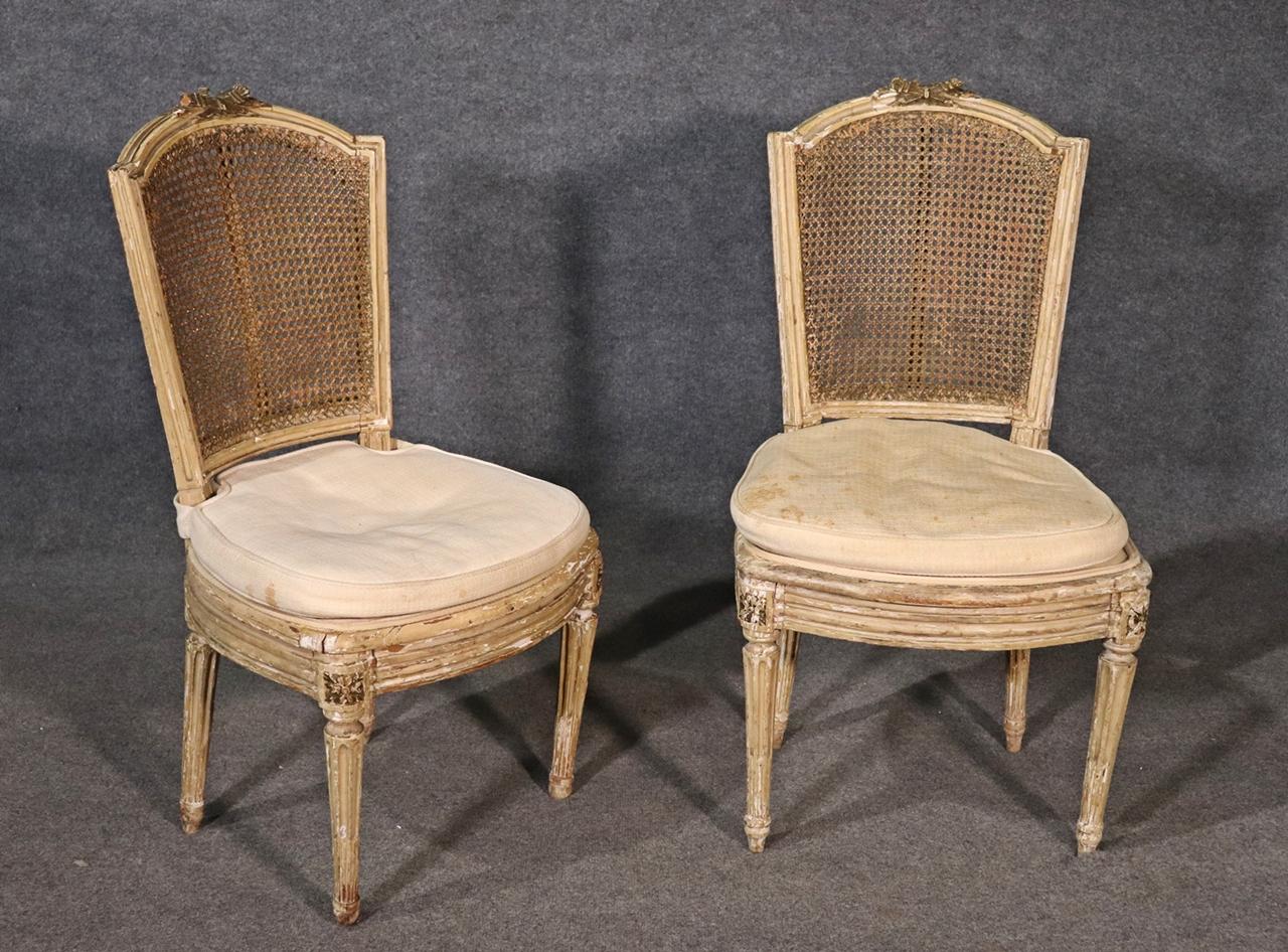 Pair of Antique Paint Decorated Cane Back French Louis XVI Chairs, Circa 1860s In Fair Condition For Sale In Swedesboro, NJ