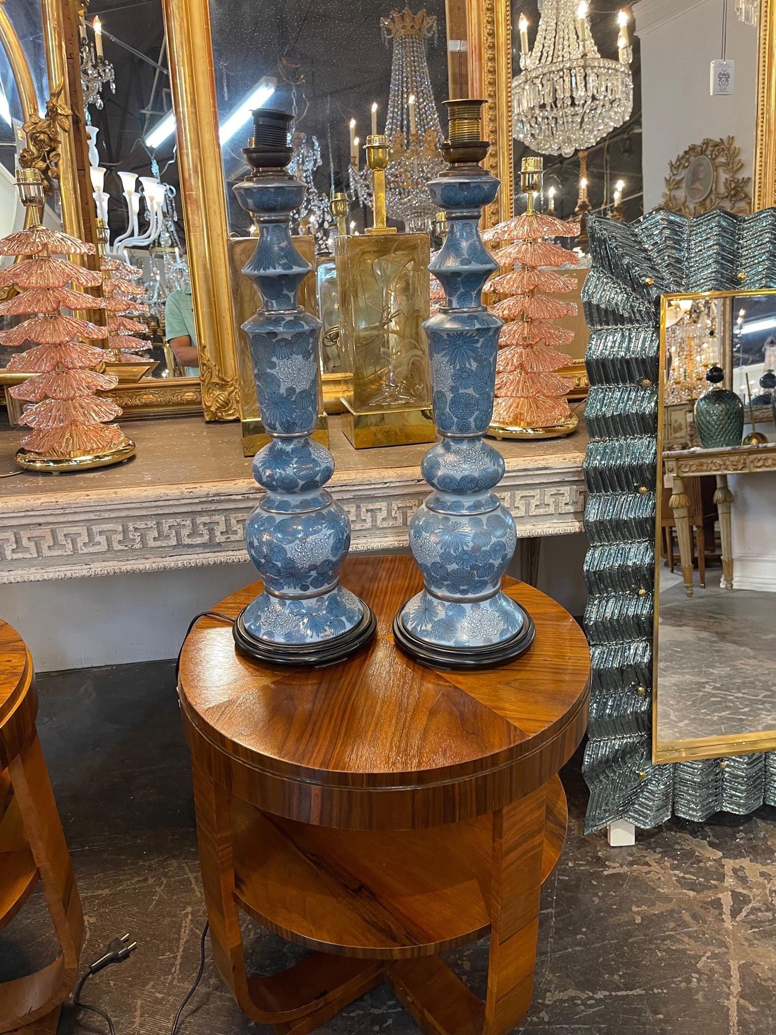 Exquisite pair of antique painted porcelain lamps. These have beautiful shades of blue and a lovely floral pattern. So pretty!