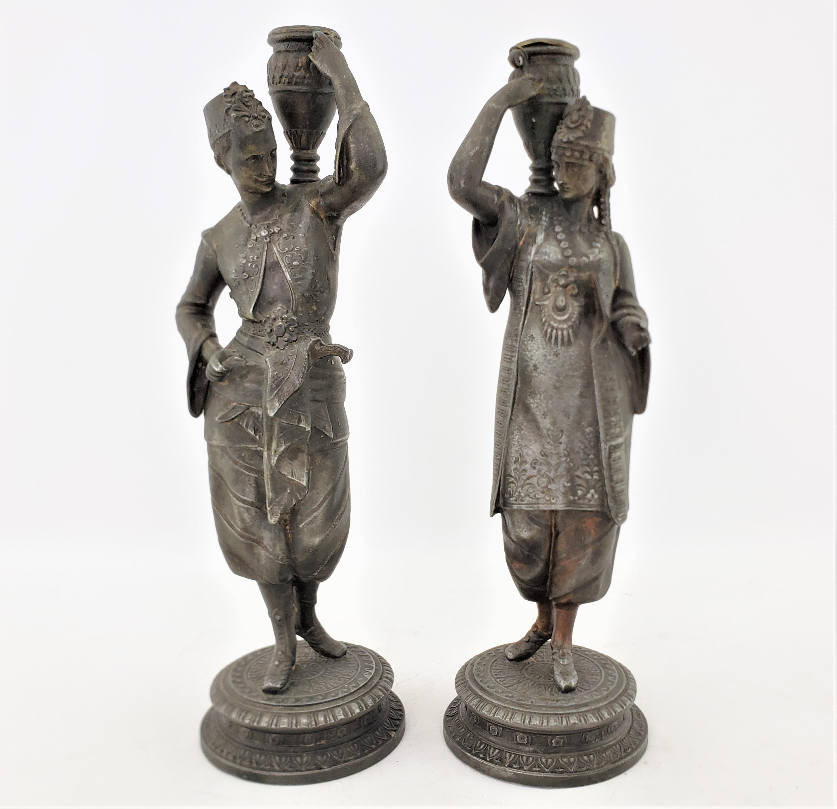 Pair of Antique Patinated Spelter Candlesticks of a Man & Woman Carrying Water For Sale 2