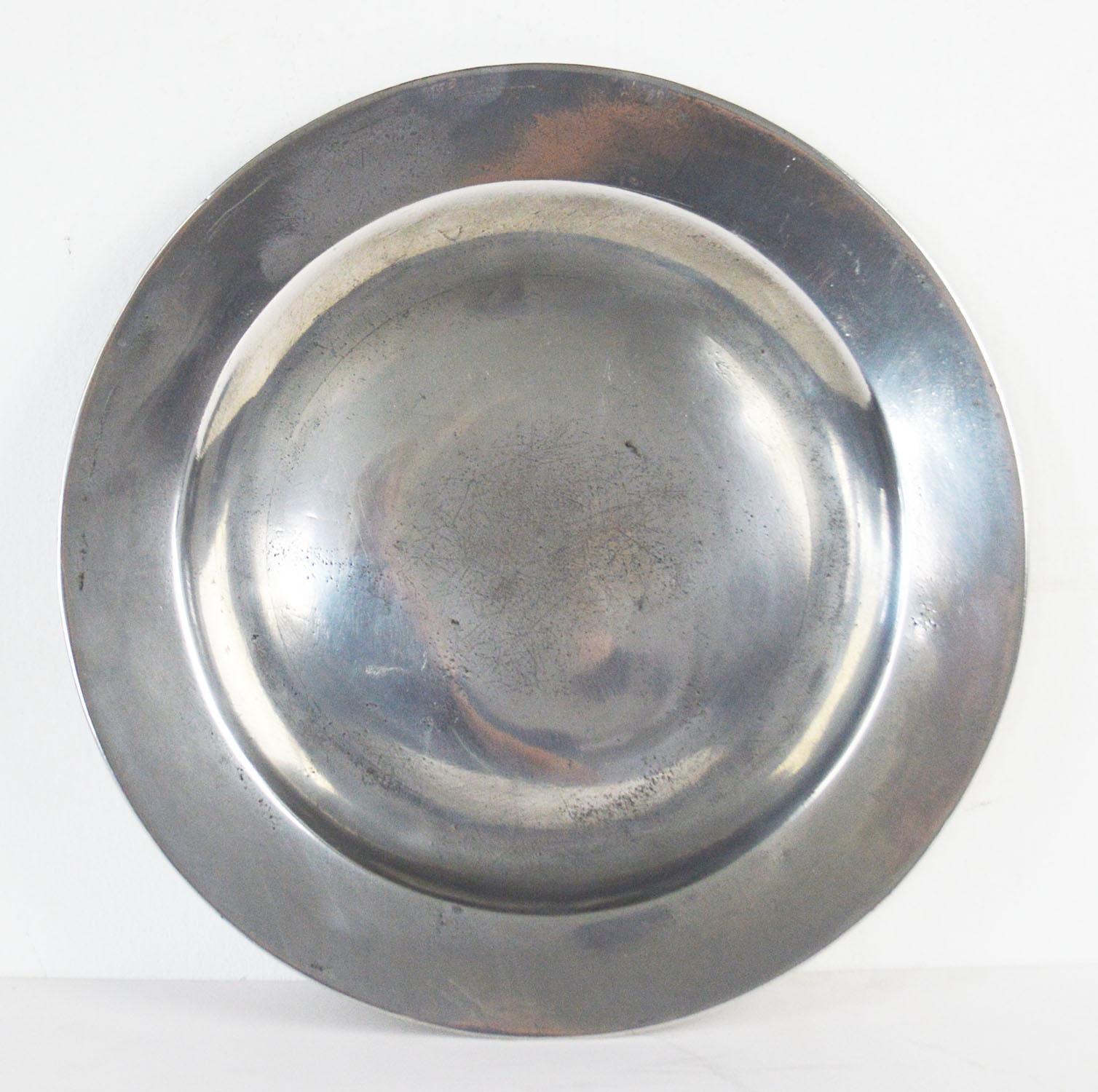 Wonderful highly polished pewter plates

English, late 18th century, London maker, measures: 9.5 inches.

The pewter has been polished to its original shine to imitate polished silver. It was known as the Poor Man's Silver.

Rubbed touch marks