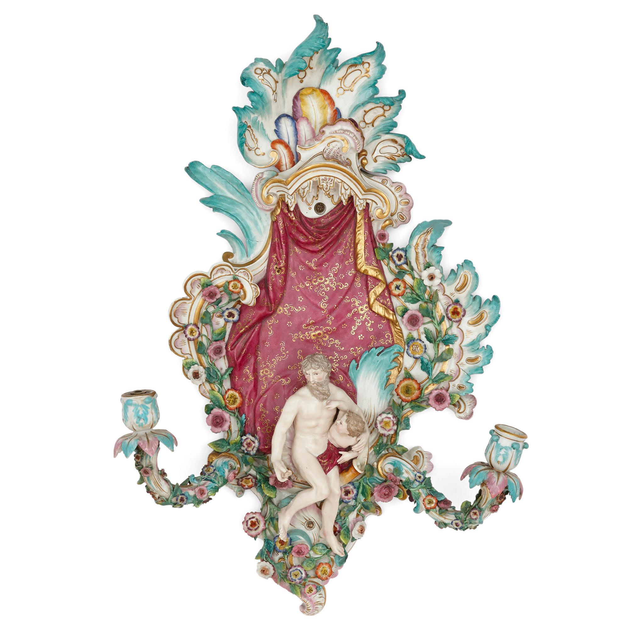 Pair of antique porcelain sconces by Meissen
German, late 19th Century
Measures: Height 57cm, width 38cm, depth 10cm

This fine pair of German Rococo style Meissen sconces features beautifully encrusted porcelain flowers and petals and