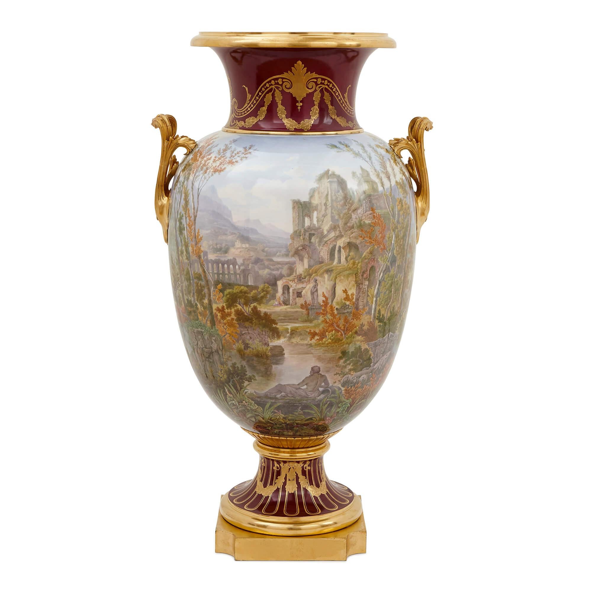 These vases display the kind of fine detailing and gilding that the Sevres Porcelain Manufactory was renowned for in the 18th and 19th Centuries. These large vases - each measuring 93cm (37 inches) in height - were produced at Sevres during the