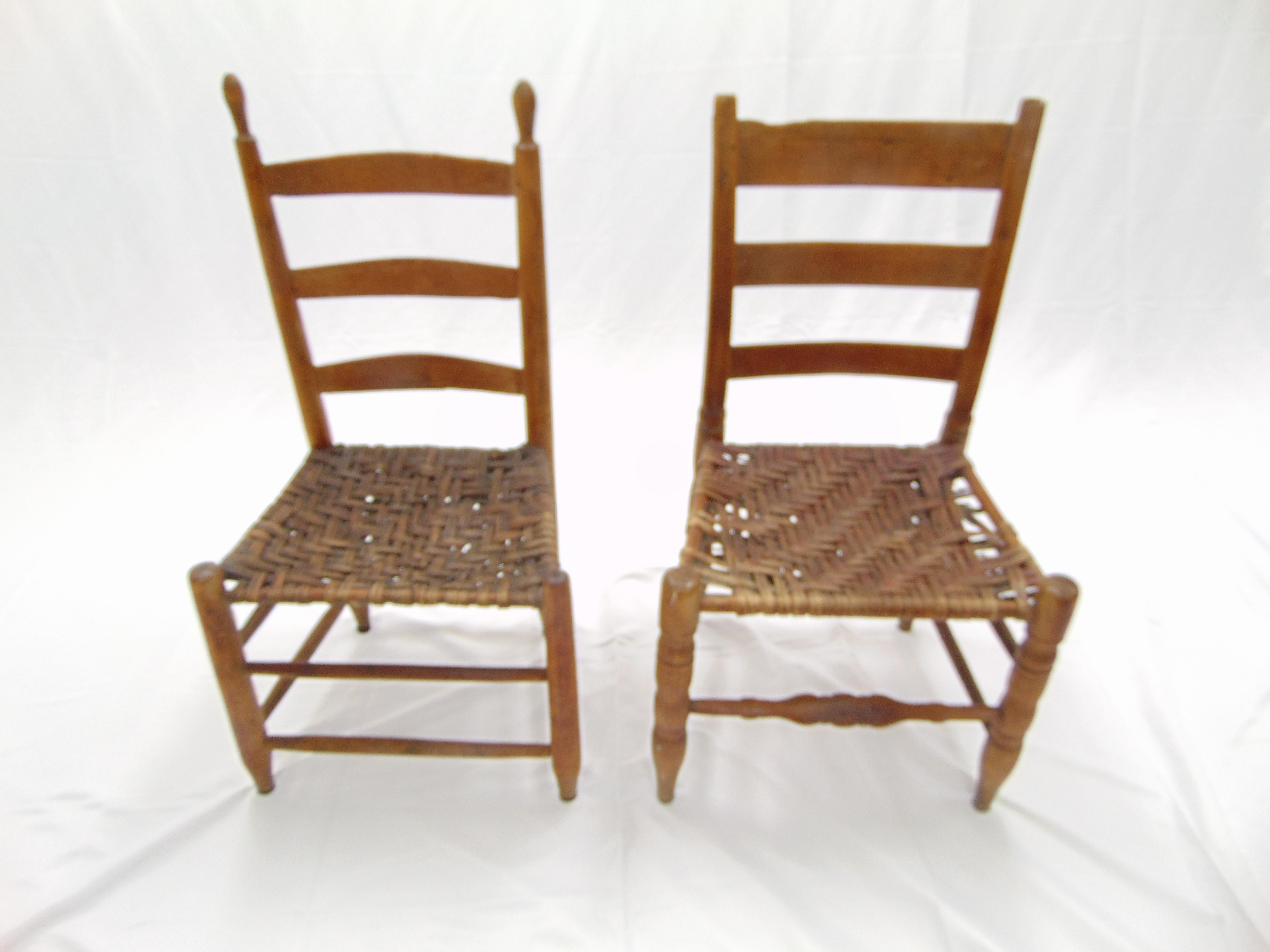These are a pair of slightly different antique Primitive ladder back chairs. Even though they are different because of their size and age they go together perfectly! These chairs are from the 19th century and are American in style and make. They