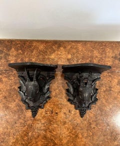 Pair of antique quality Black Forest carved wall brackets