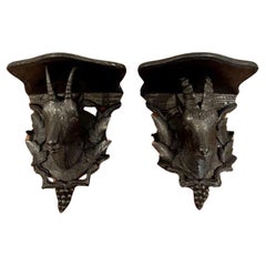 Pair of antique quality Black Forest carved wall brackets