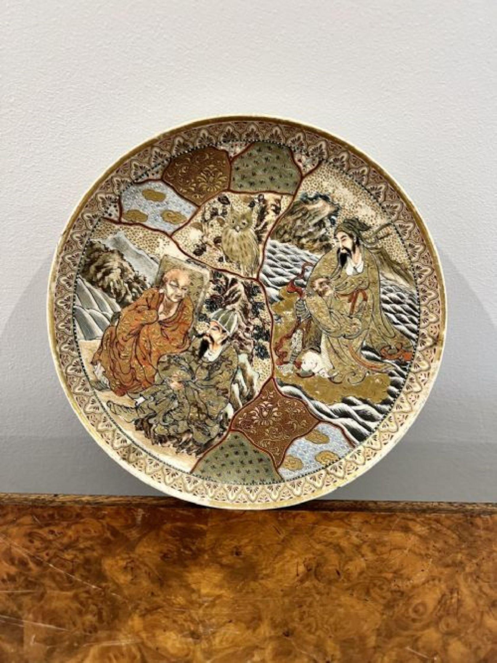 Pair of antique quality Japanese satsuma plates decorated with various traditional figures and mountainous landscapes with an owl and other birds in wonderful red, green, orange, yellow, blue and gold colours 