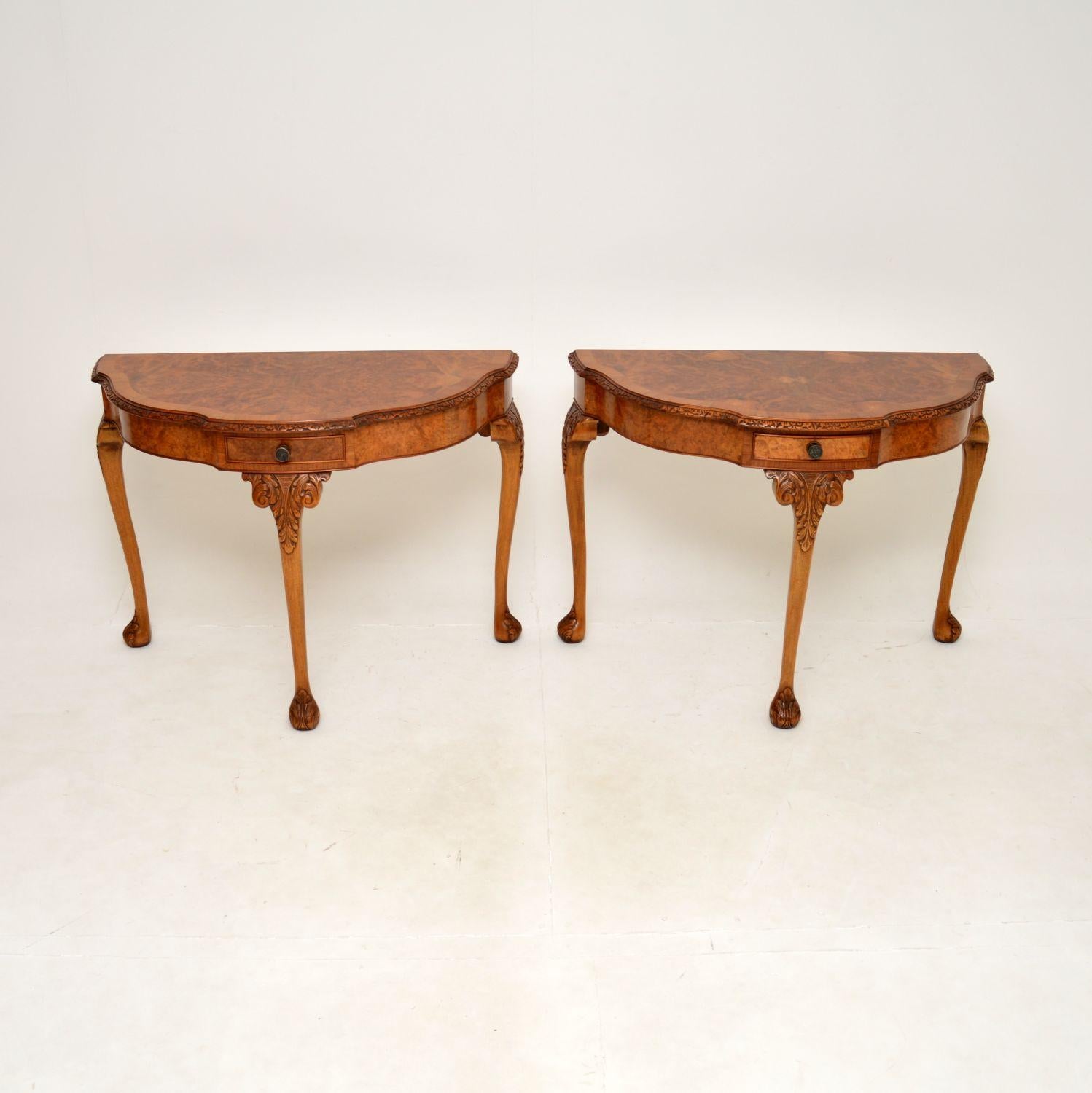 A beautiful and extremely well made pair of antique Queen Anne style burr walnut console tables. They were made in England, they date from around the 1930’s & it’s very rare to find a pair of these.

The quality is outstanding, they have gorgeous