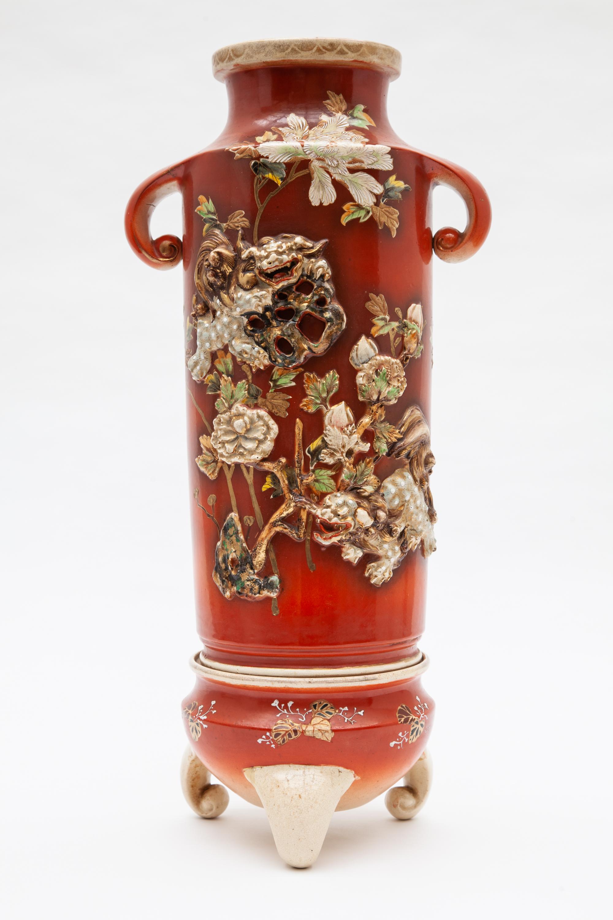 Antique Japonese vases with three-footed stands, marked.
Meiji period (1868-1912) of one of the best Japanese makers for export to the European market.
A pair of ceramic hand painted vases features a three dimensional dragon and cherry blossom