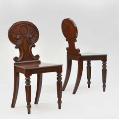 Pair of antique Regency mahogany hall chairs in the manner of Gillows