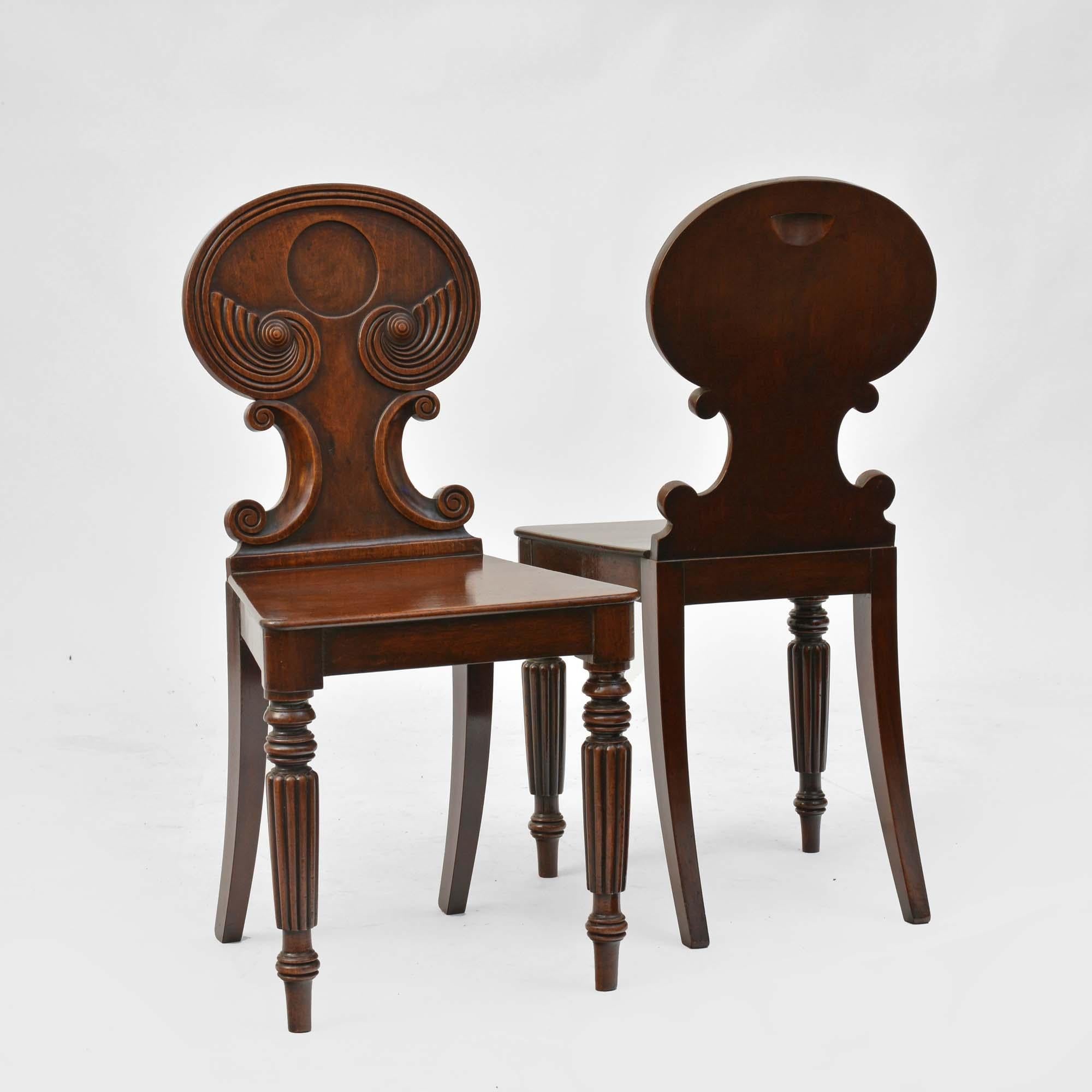 English Pair of antique Regency mahogany hall chairs in the manner of Gillows For Sale