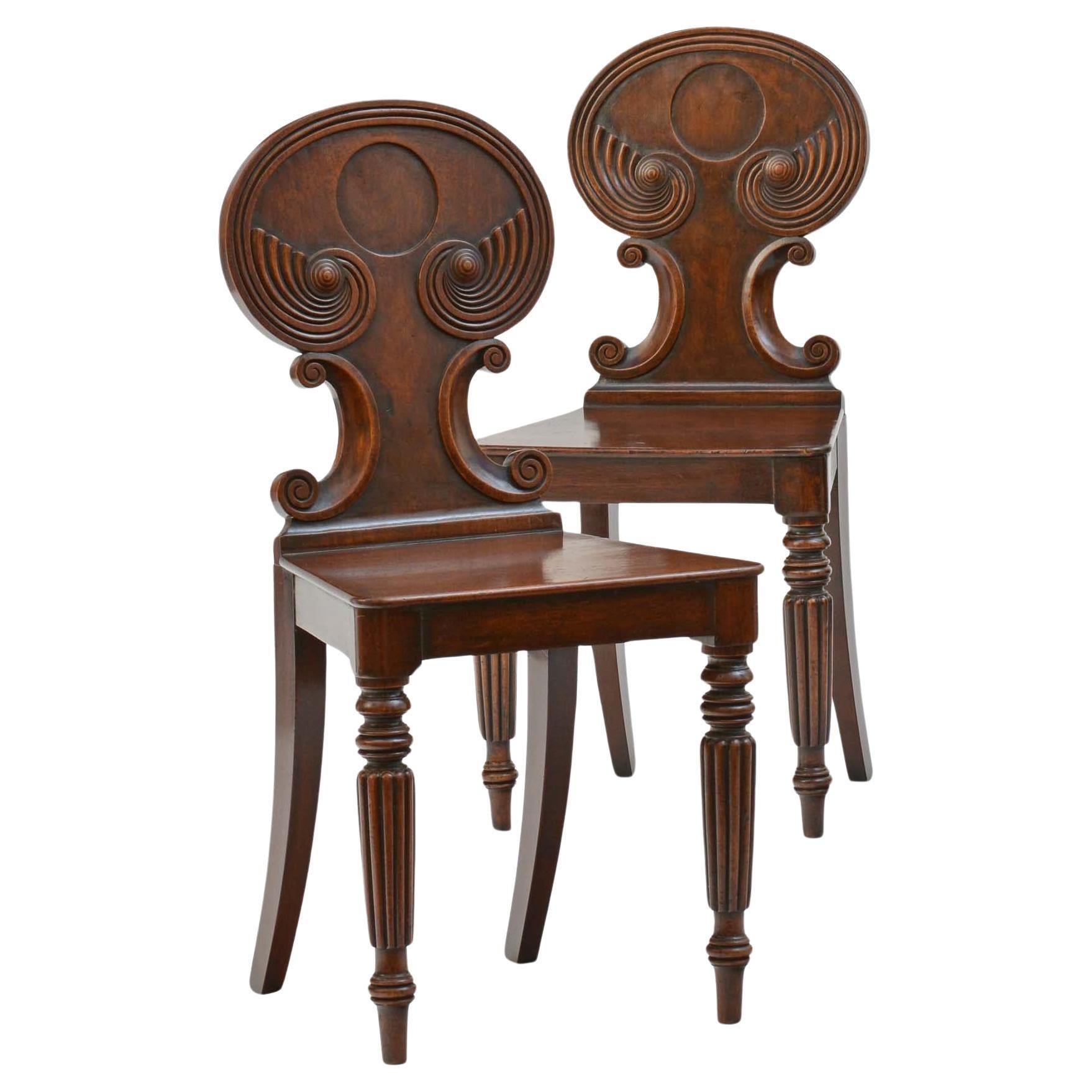 Pair of antique Regency mahogany hall chairs in the manner of Gillows For Sale