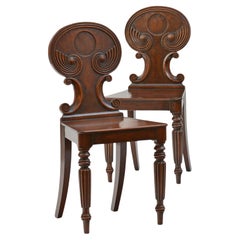 Pair of antique Regency mahogany hall chairs in the manner of Gillows