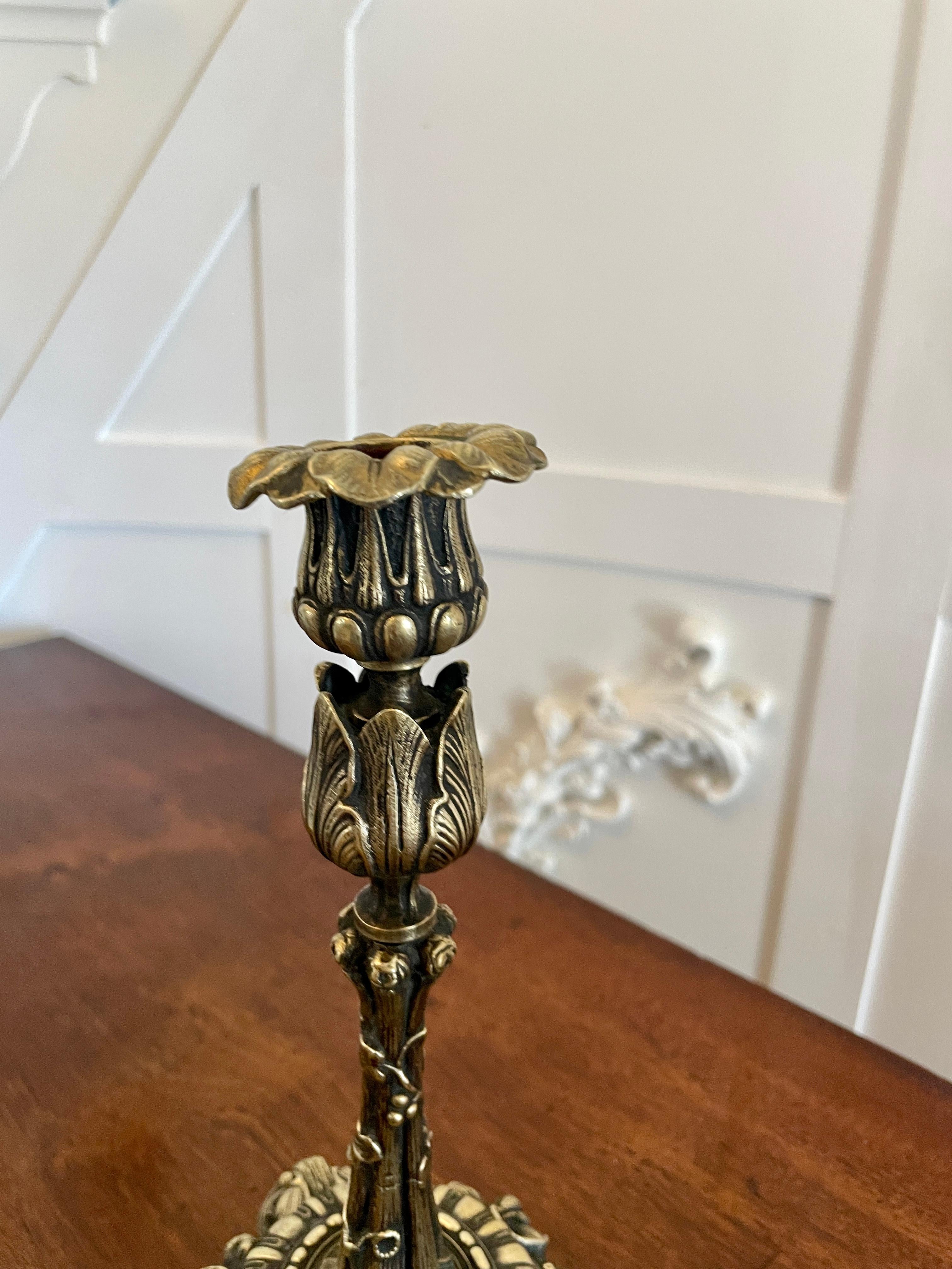 Pair of antique Regency quality ornate brass candlesticks having a quality pair of antique regency brass candlesticks with ornate decoration 

Measures: H 23.5cm x W 13 x D 13cm
Date 1825.
  