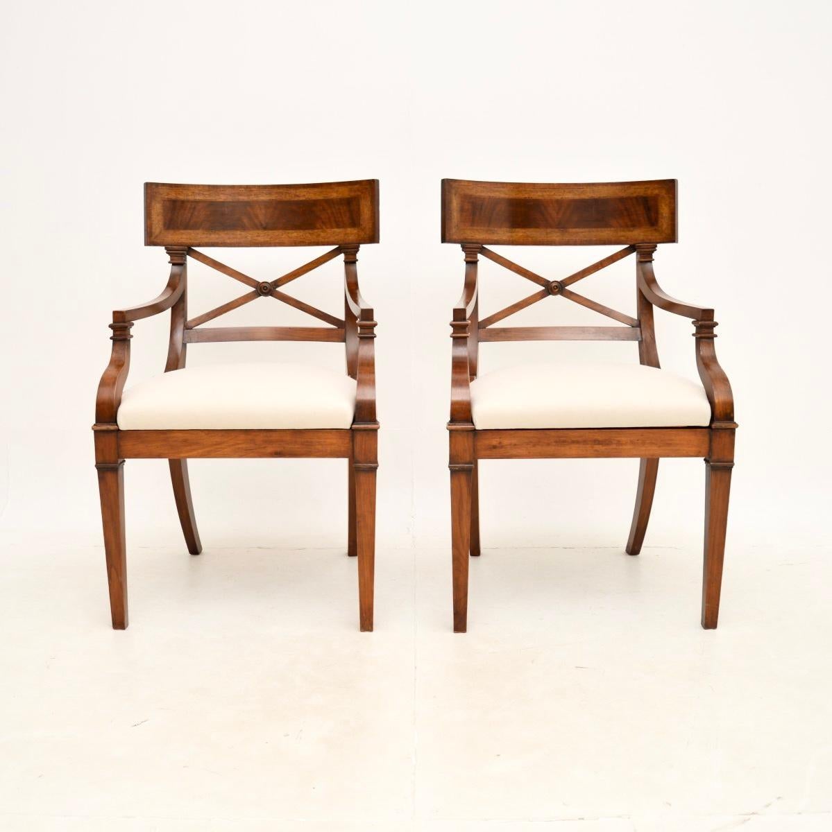 A smart and very well made pair of antique Regency style armchairs. They were made in England, and date from around the 1950’s.

The quality is outstanding, these are beautifully crafted with lovely inlaid borders on the Trafalgar back rests. They