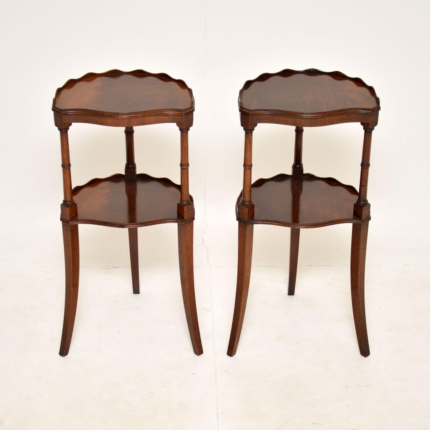 A beautiful pair of antique side tables, made in England, and dating from around the 1930’s.

They are of lovely quality, each has two tiers with raised pie crust edges. They are a very useful size and are nicely finished on all sides, so can be