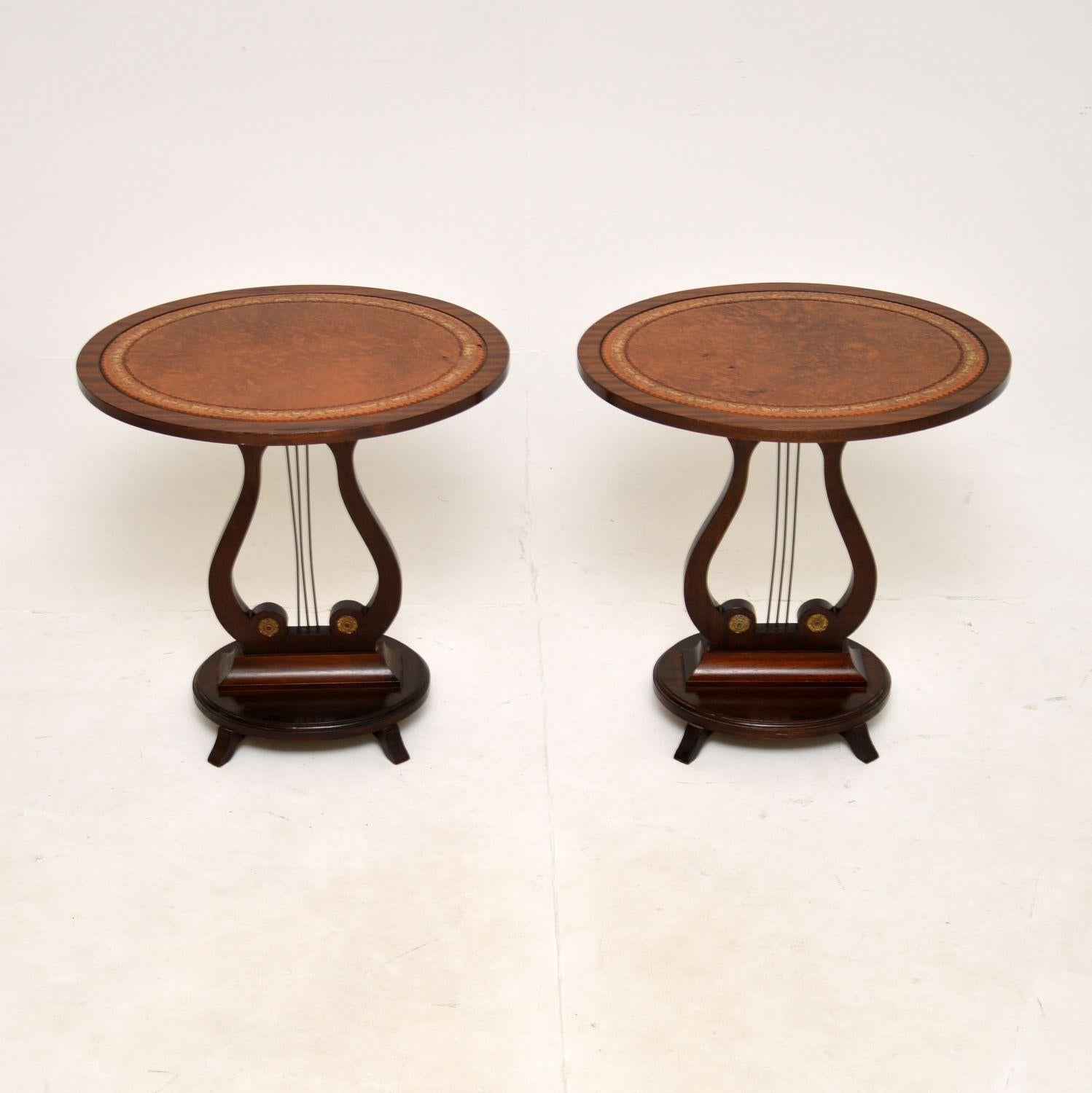 A lovely pair of antique Regency style side tables. They were made in England, they date from around the 1950’s.

The quality is excellent, they are beautifully designed with inset leather on the leather tops, and brass fixtures on the bottom. They