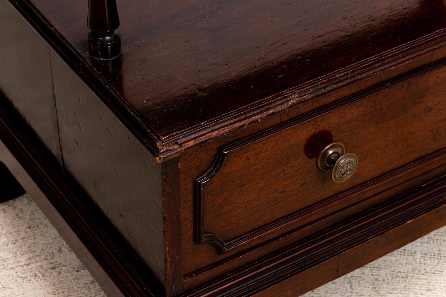 Pair of antique Regency style three tier side tables with bottom drawer and bracket shaped feet. Please note of wear consistent with age including chips, scratches, and finish loss.