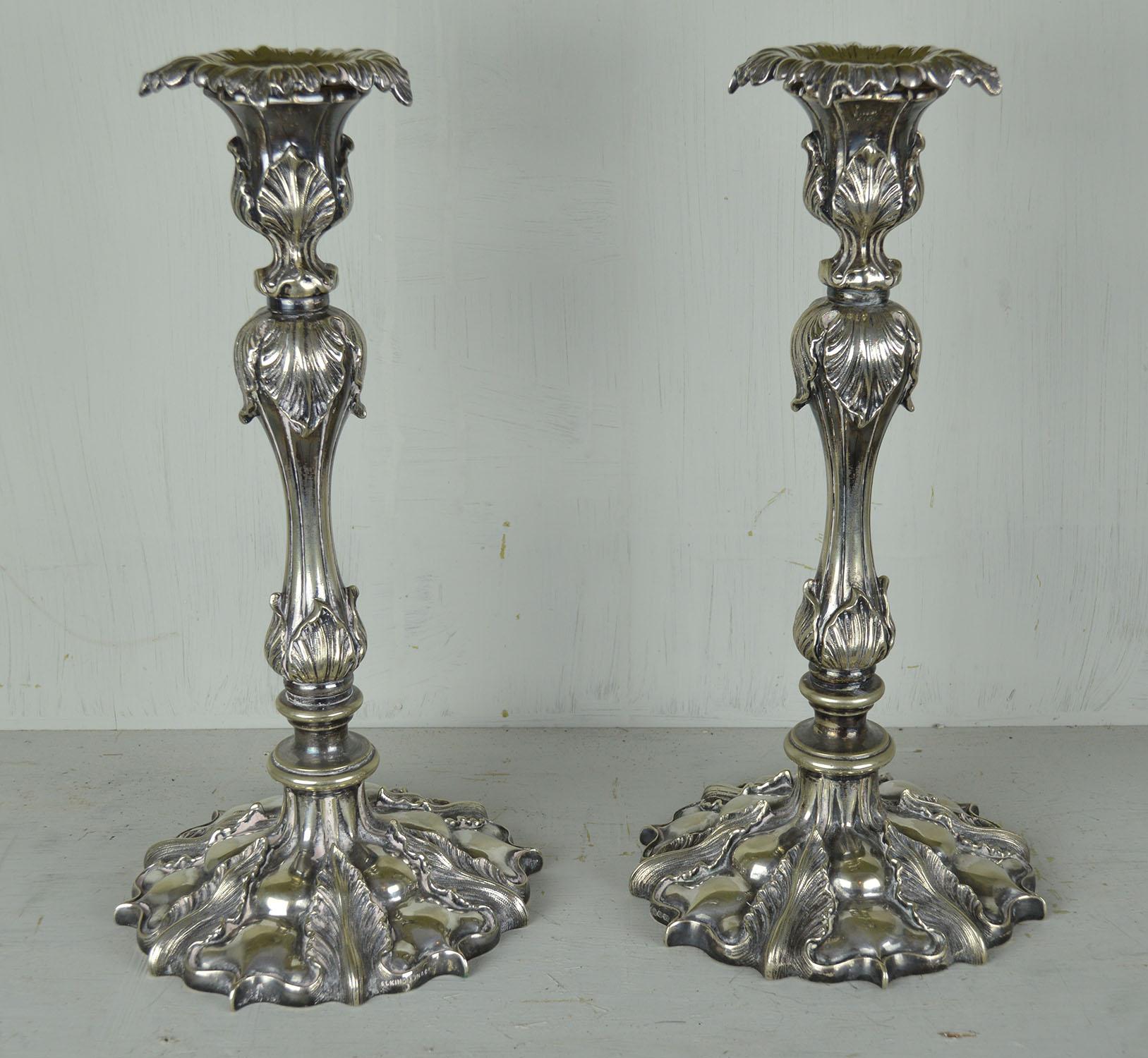 Wonderful pair of renaissance revival silver plated candlesticks.

I have chosen not to clean or re-plate the silver. As they are they have a great distressed look.

Heavy cast metal. Makers mark of Elkington & Co. on the base.



 