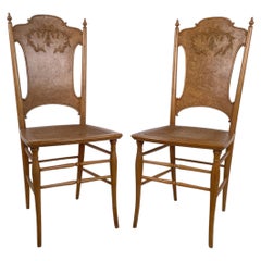 Pair of Antique Ribbon Carved Caned Seat Side Chairs