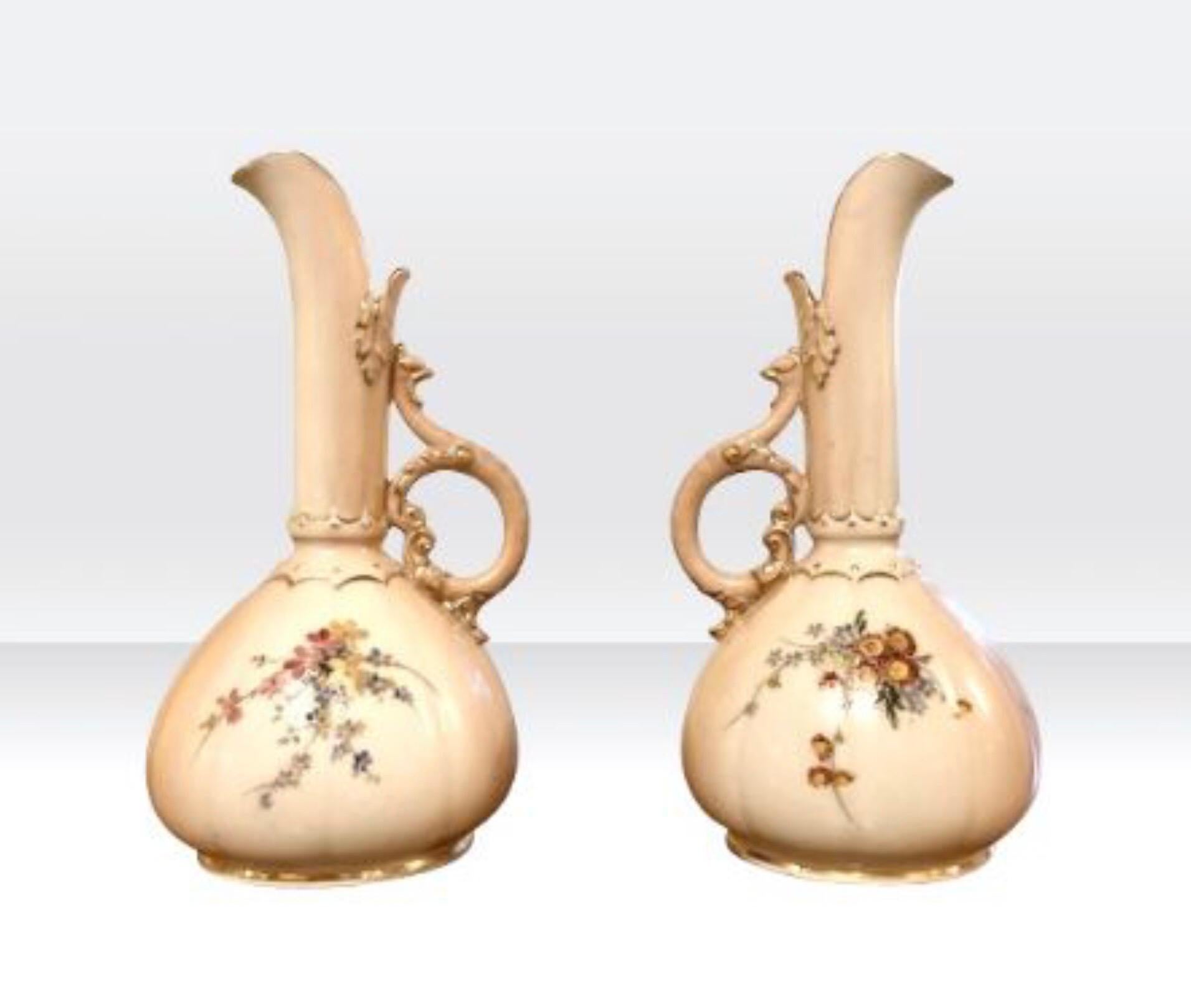 Stunning pair of antique Royal Worcester vases, Ewers.
Blush ivory hand painted with flowers and foliage.
Dated 1904.
Shape number 1143.
Measures: 15.5cm x 8cm x 8cm.
    