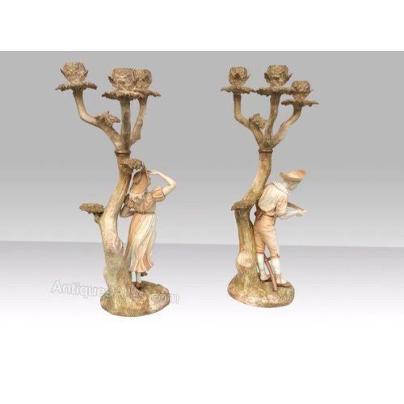Stunning pair of antique Royal Worcester candelabra signed by James Hadley.

Perfect condition. 
Puce mark. 
Circa 1876 
Measures: 21ins high x 7ins deep 
 
Declaration: This item is antique. The date of manufacture has been declared as 1870.