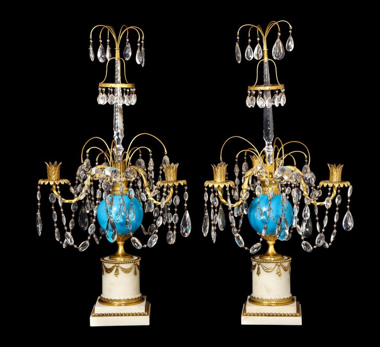 A pair of exquisite antique Russian neoclassical gilt bronze, blue opaline glass, cut crystal and white marble candelabras of superb detail embellished with a central blue opaline glass ball, cut crystal chains with gilt bronze arms and finally