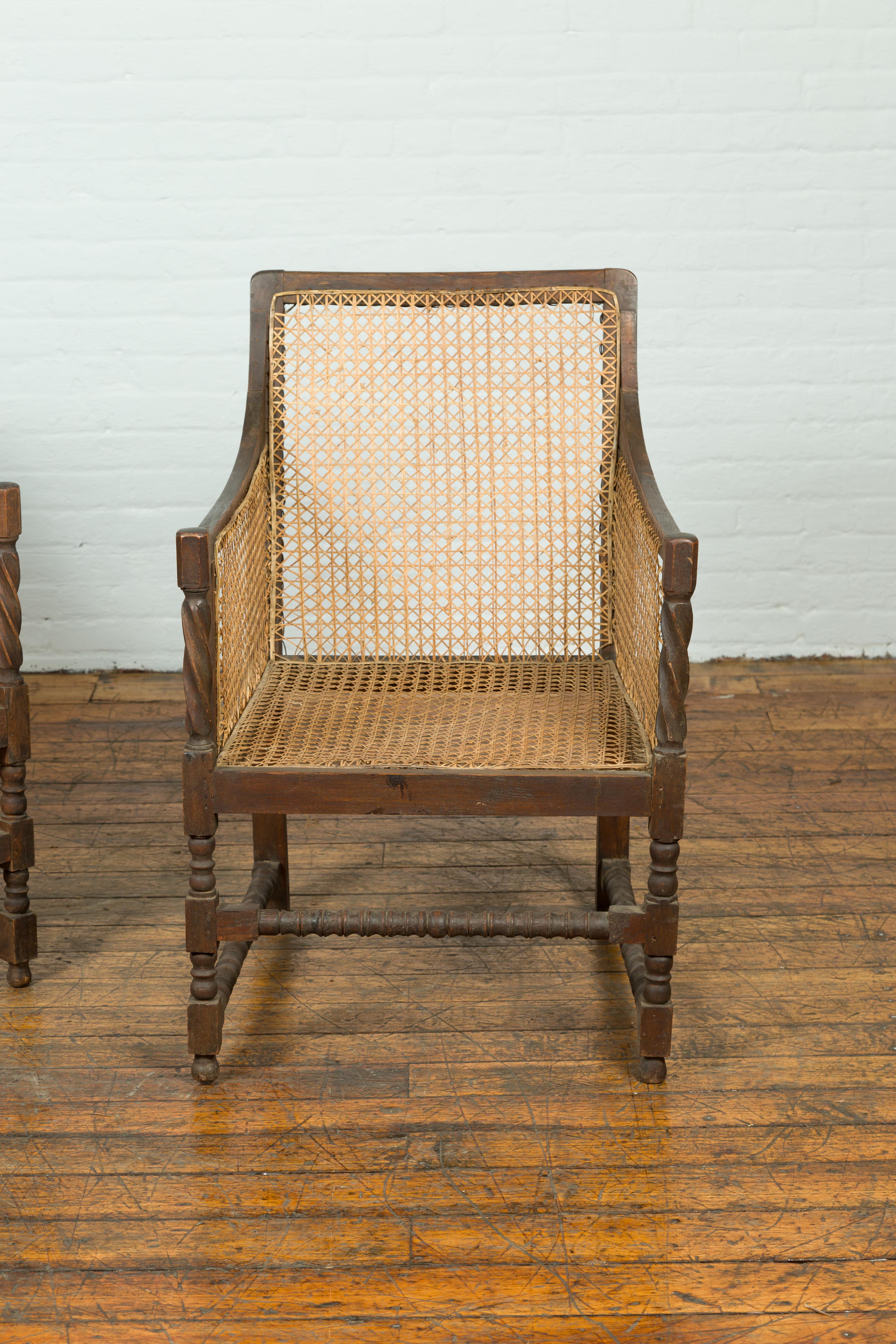 Pair of Antique Rustic Thai Turned Wood Armchairs with Rattan Backs and Seats In Good Condition In Yonkers, NY