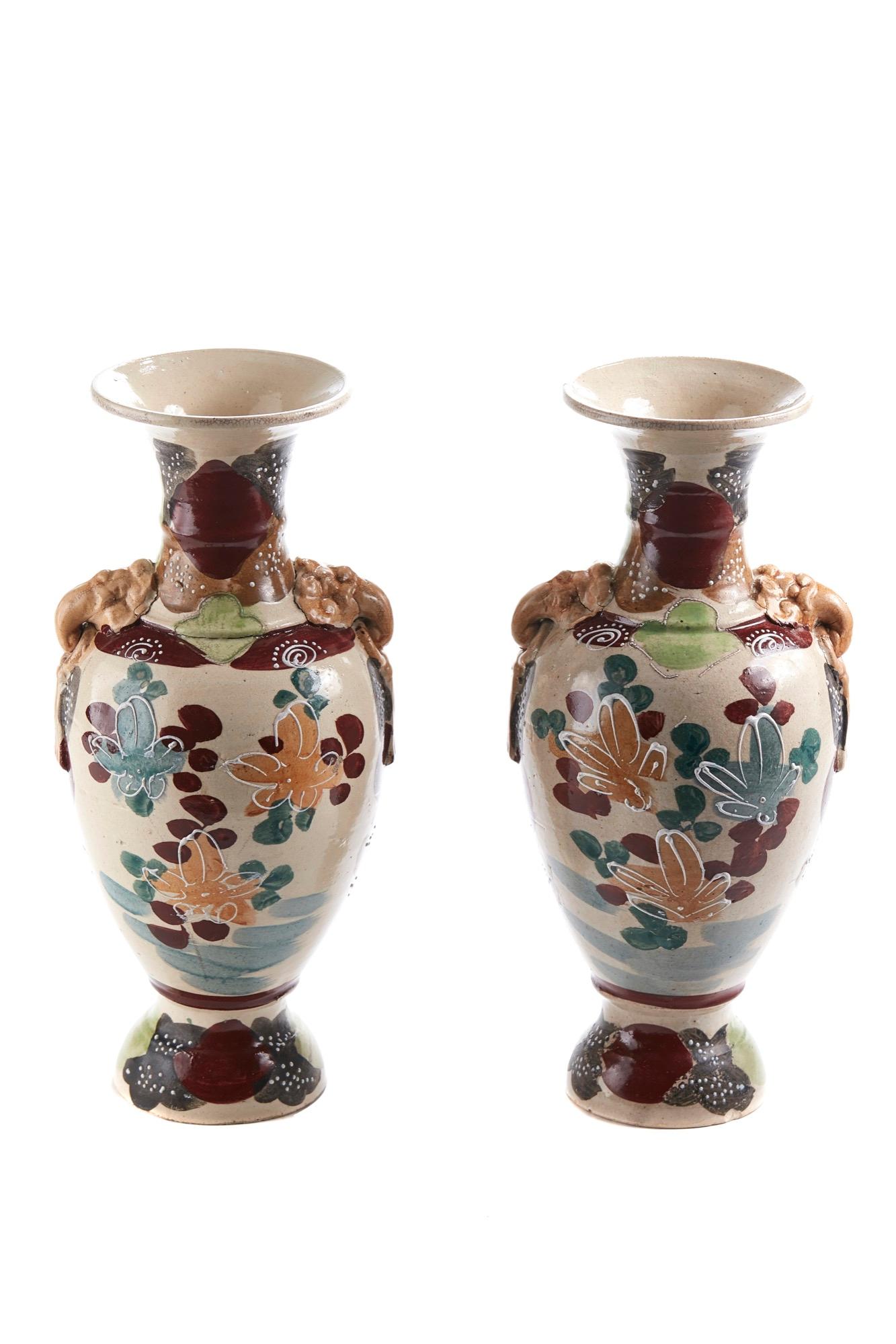 These are a pair of antique Satsuma vases that have a very colorful decoration. They are in perfect condition.