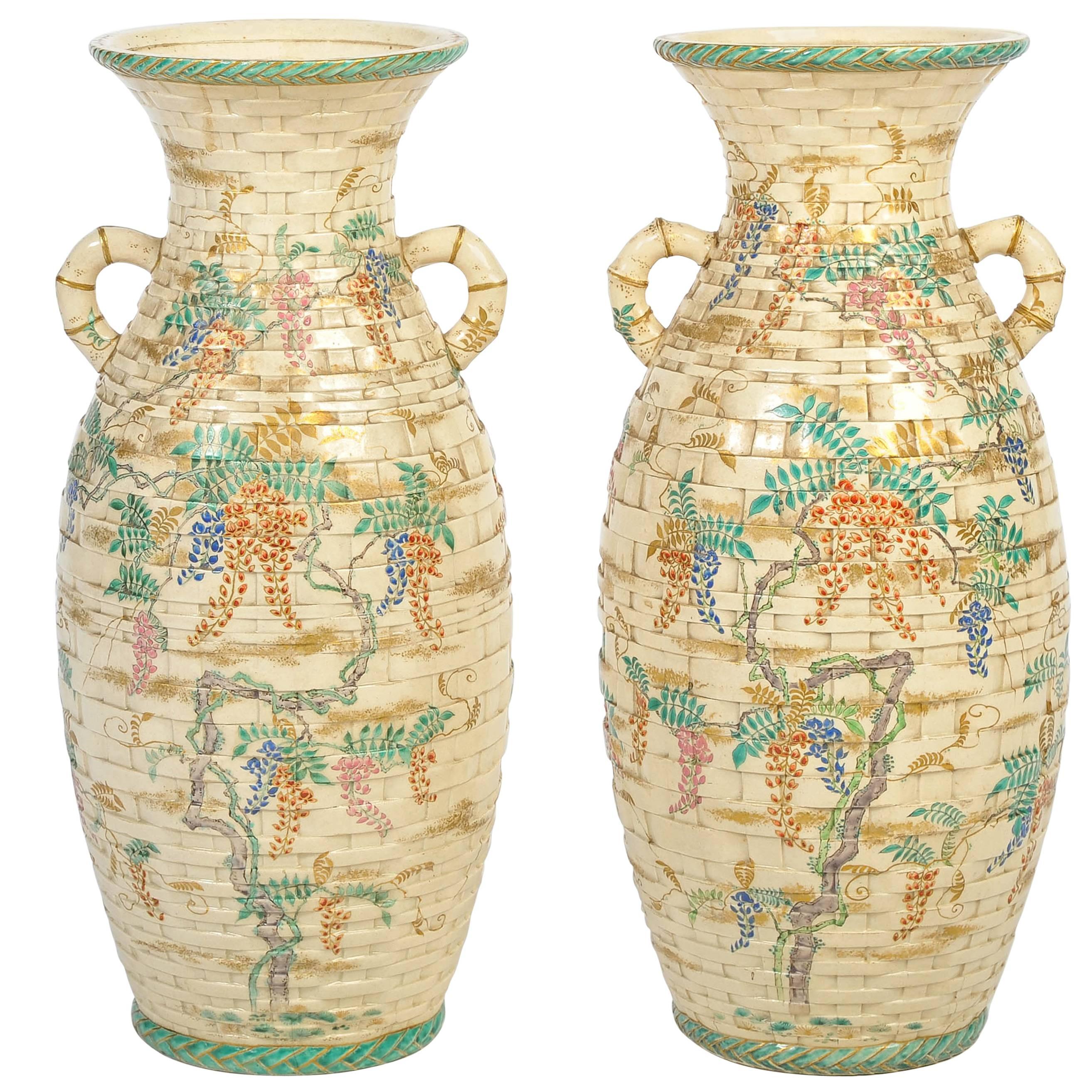 A very decorative pair of Japanese Satsuma vases, having a faux basket weave pattern with bamboo like handles and foliate painted decoration.
We can arrange of this pair of vases to be lamped if needs be, within the price.
 