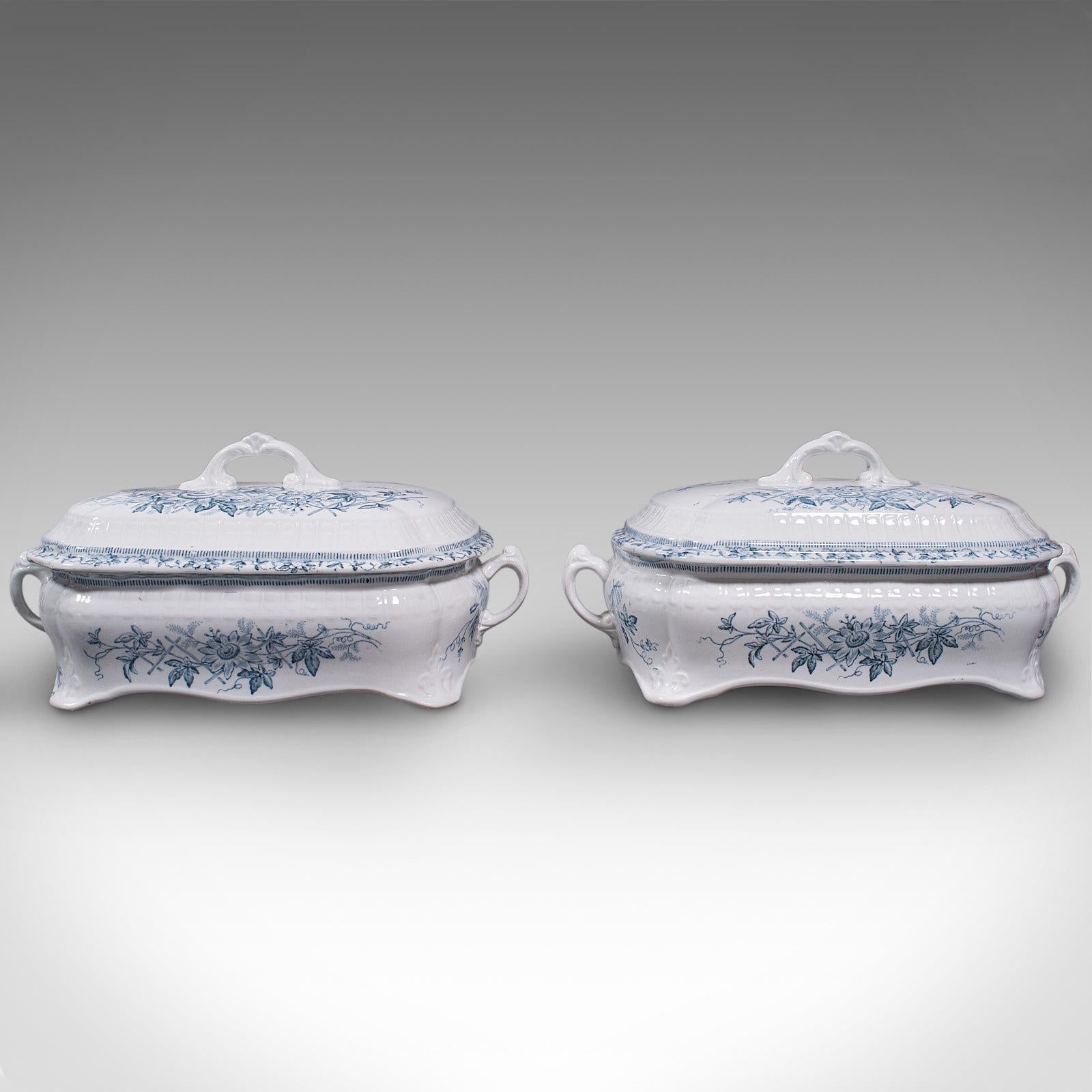 This is a pair of antique serving tureens. An English, ceramic lidded dish, dating to the late Victorian period, circa 1900.

Clear, bright ceramic tureens with appealing blue and white decoration
Displaying a desirable aged patina and in good
